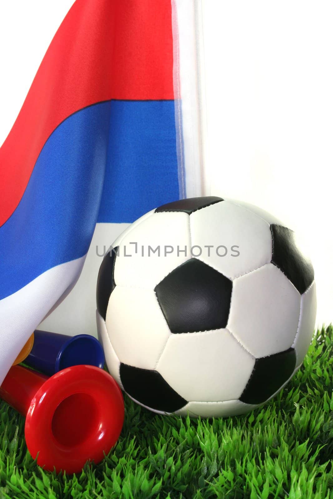 Flag of Serbia with a football in a field