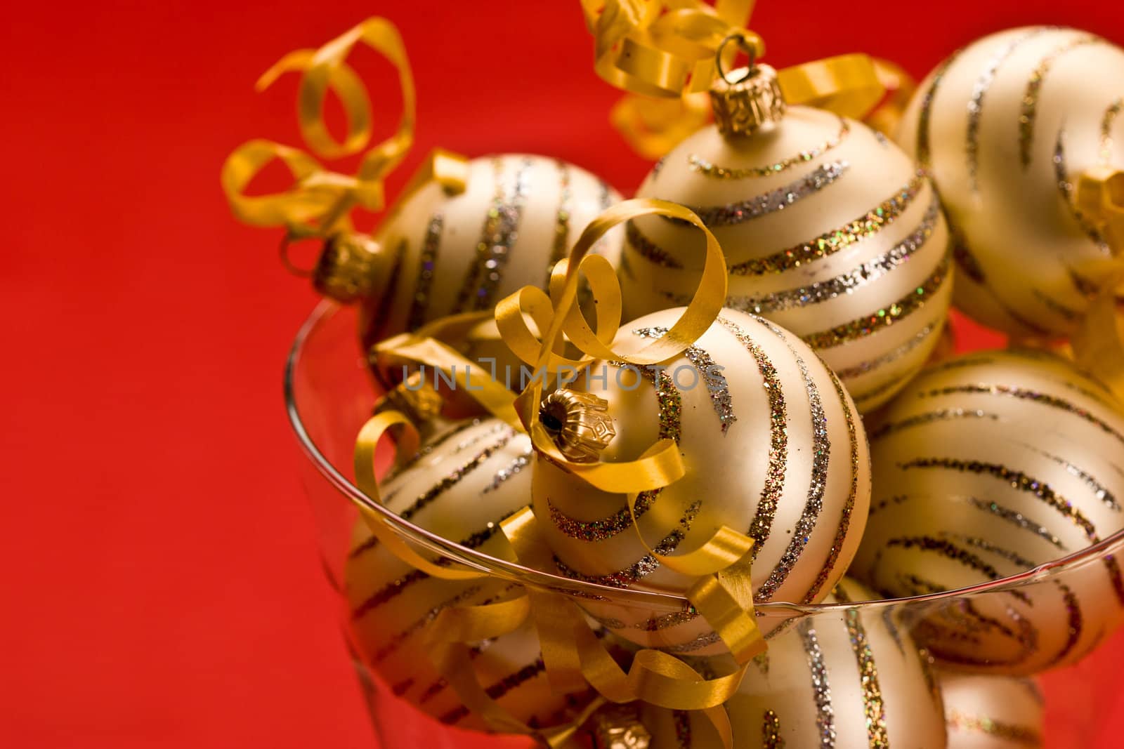 holiday series: some golden christms ball over red background