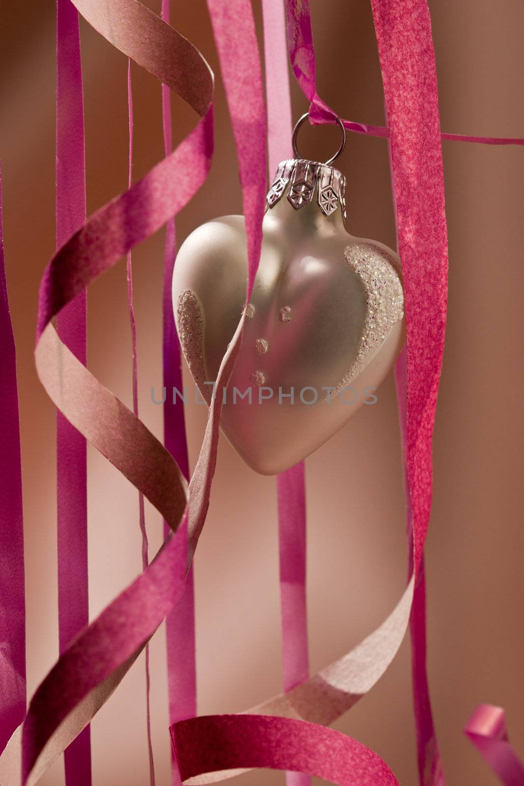 holiday series: some white christmas heart-shaped ball over light red background
