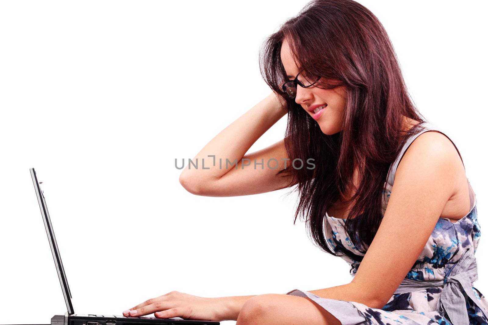 Pretty woman with confused expression working on laptop by dacasdo