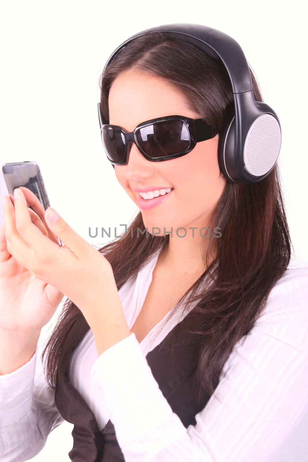 Smiling woman listening to music by dacasdo