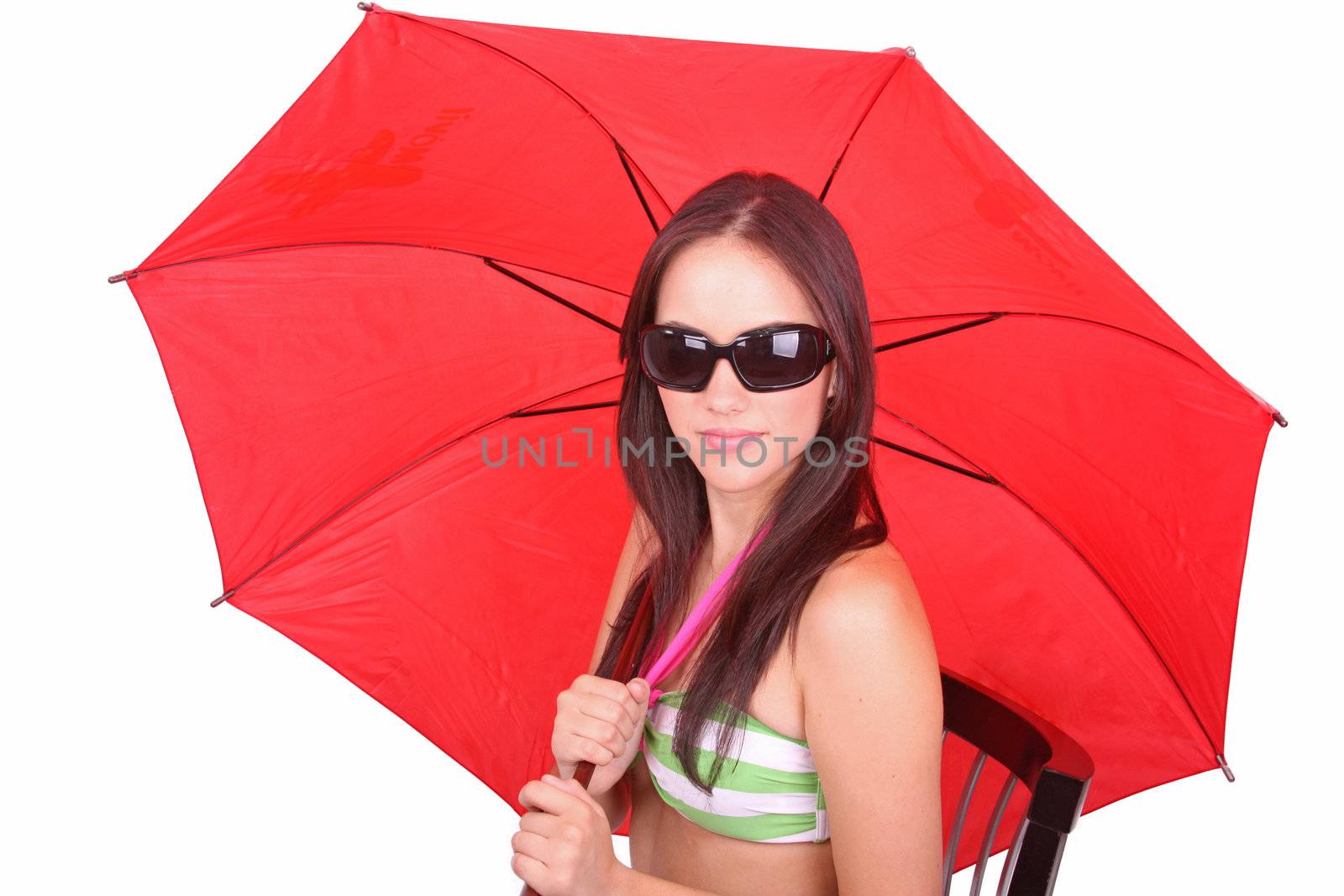 Portrait of young woman with a red umbrella on white background