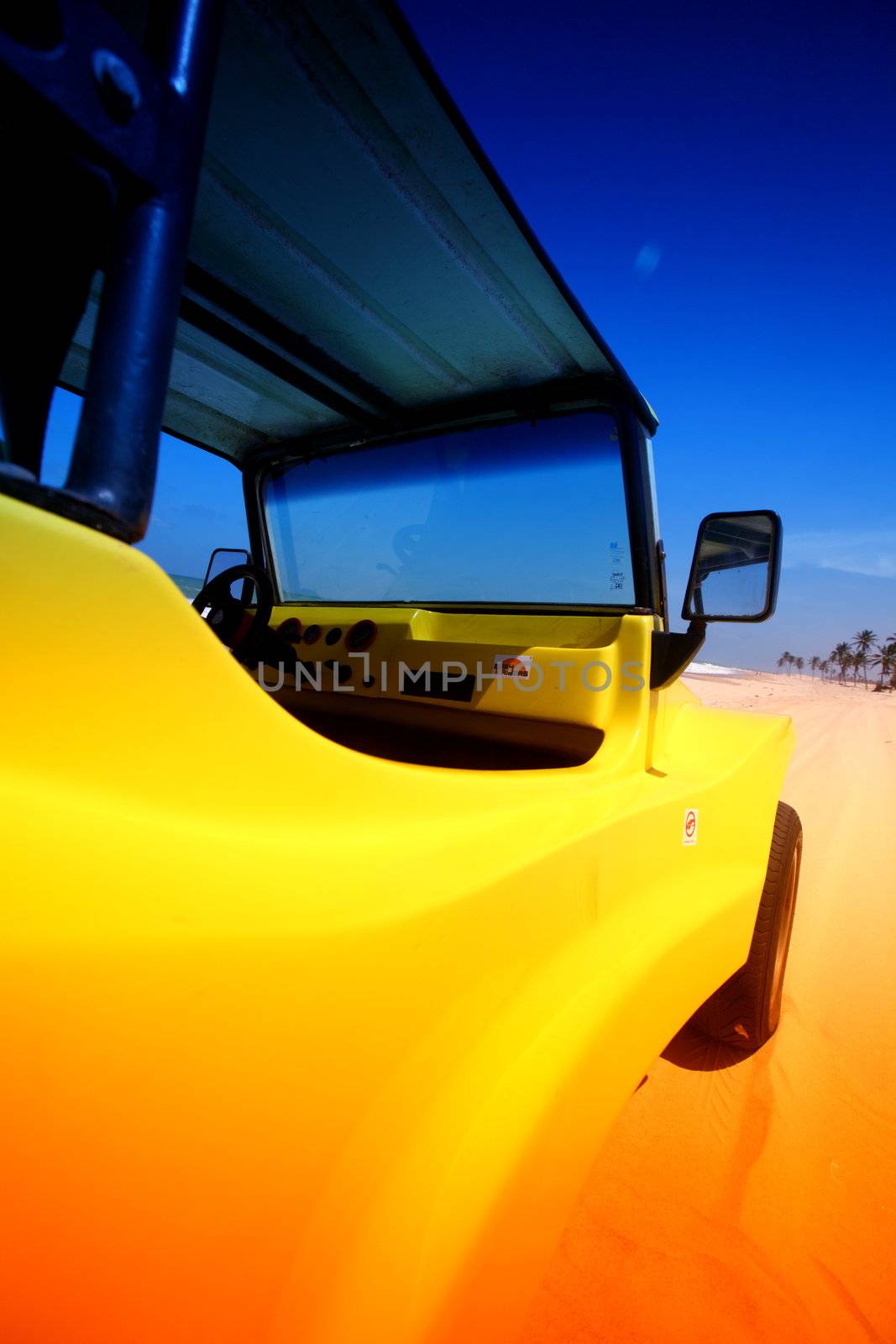 desert buggy in desert sand under blue sky