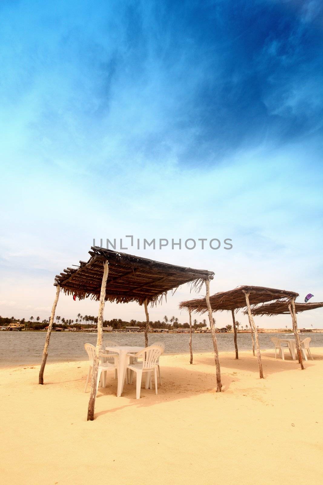 awning in sand near water