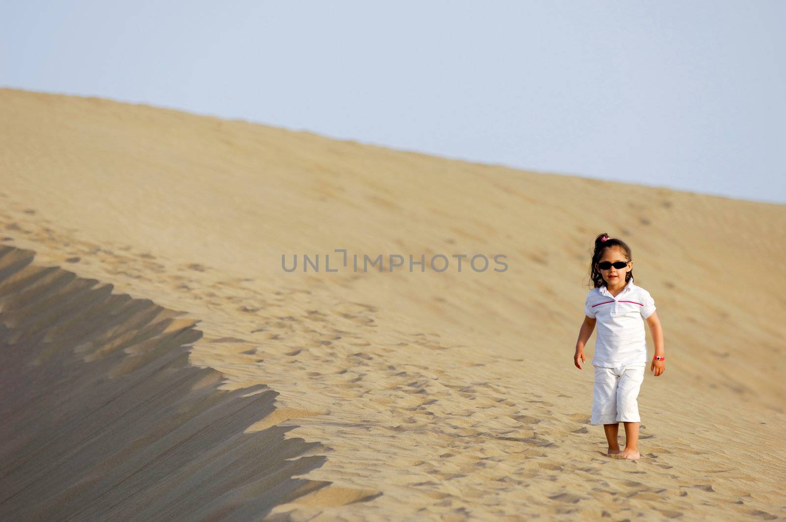 A child all alone in the desert