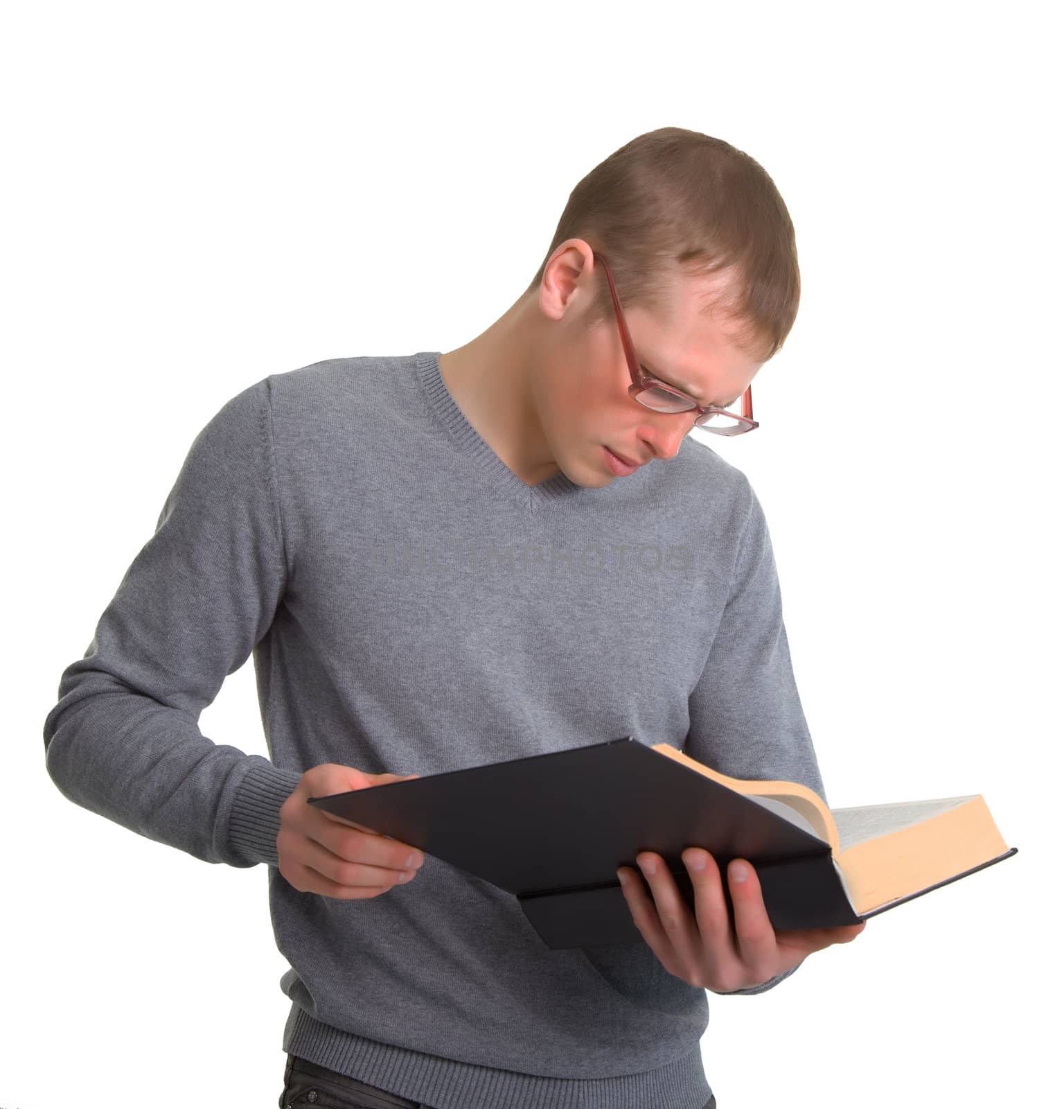 a young man reading a great book. Isolated on white background