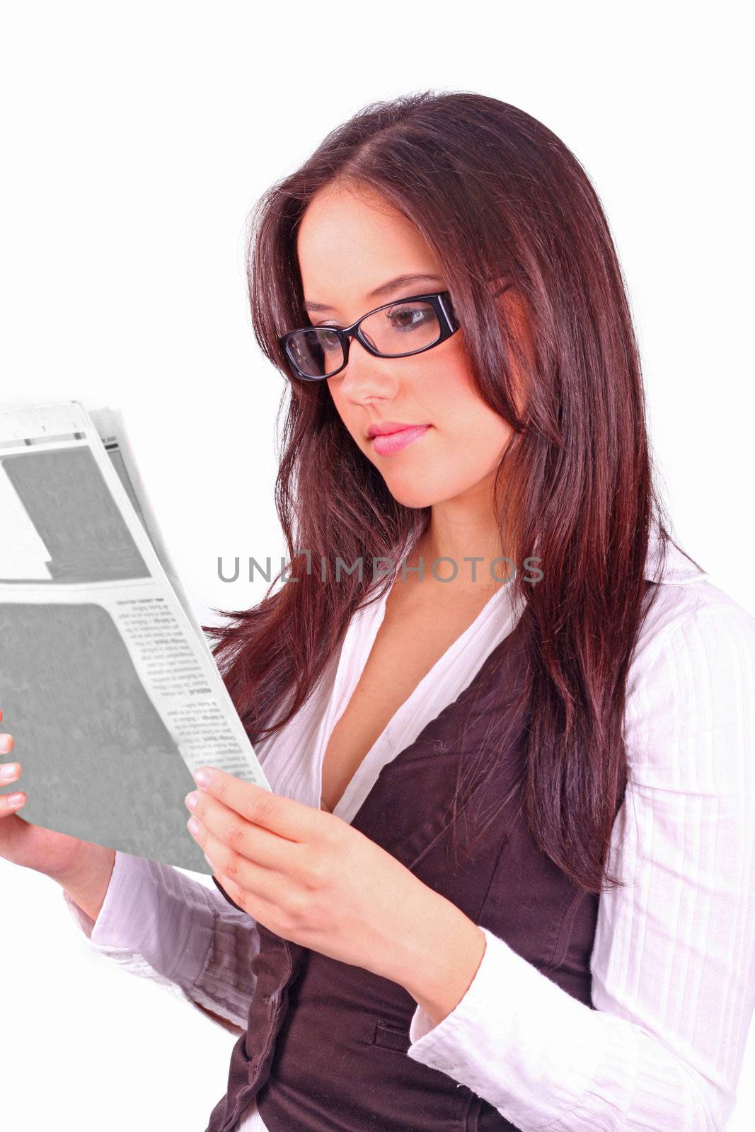 beautiful brunette reading the morning paper on a white background