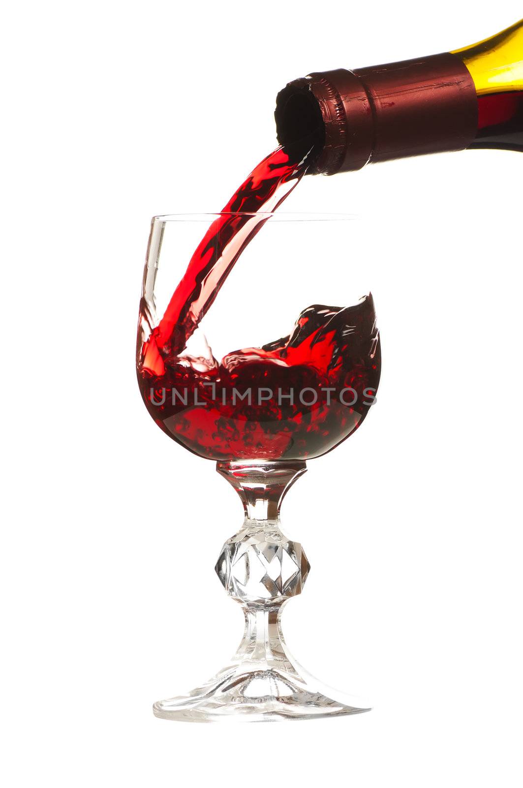 Pouring a glass of wine. Image is isolated over white background