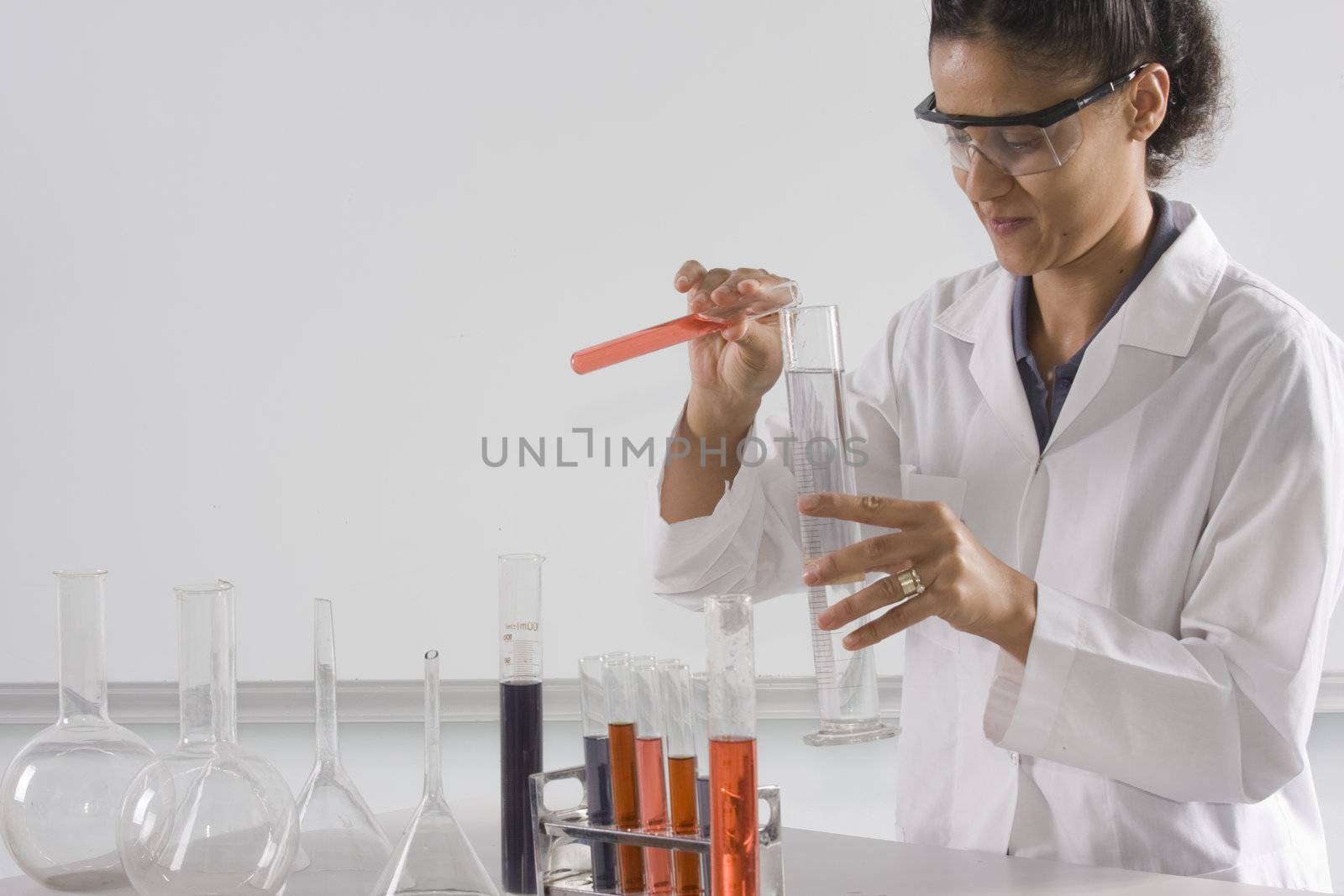 Female lab tech mixing liquids