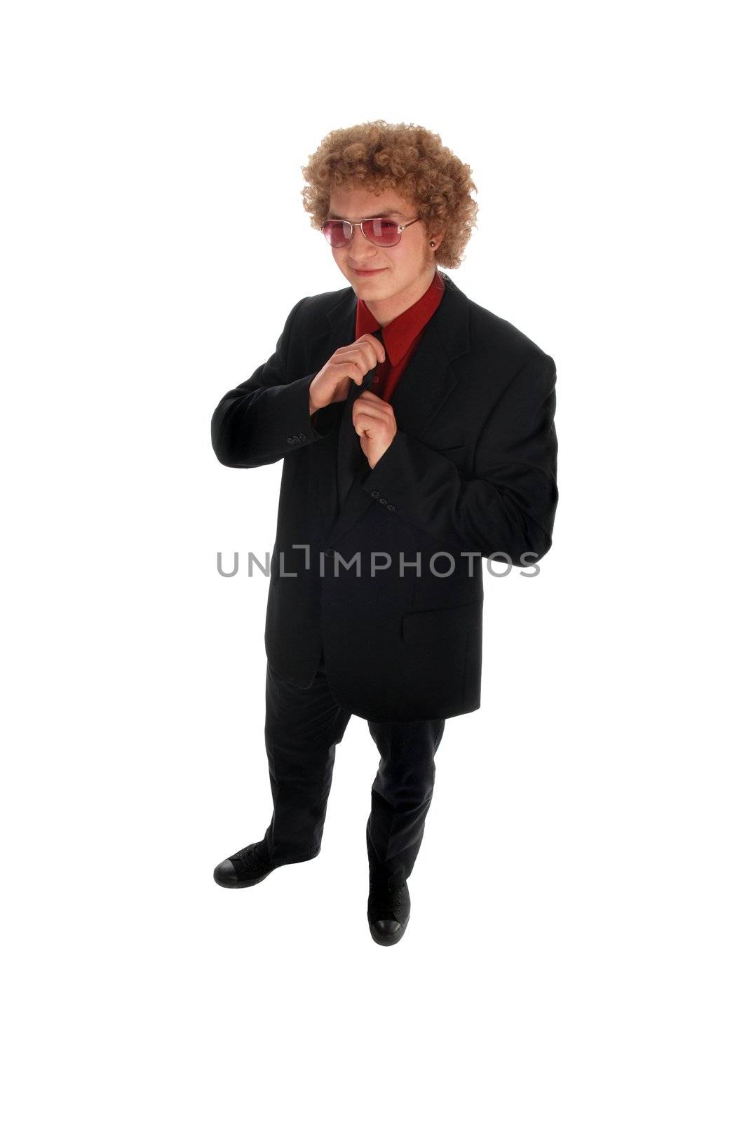 Young businessman standing in a black suit on white
