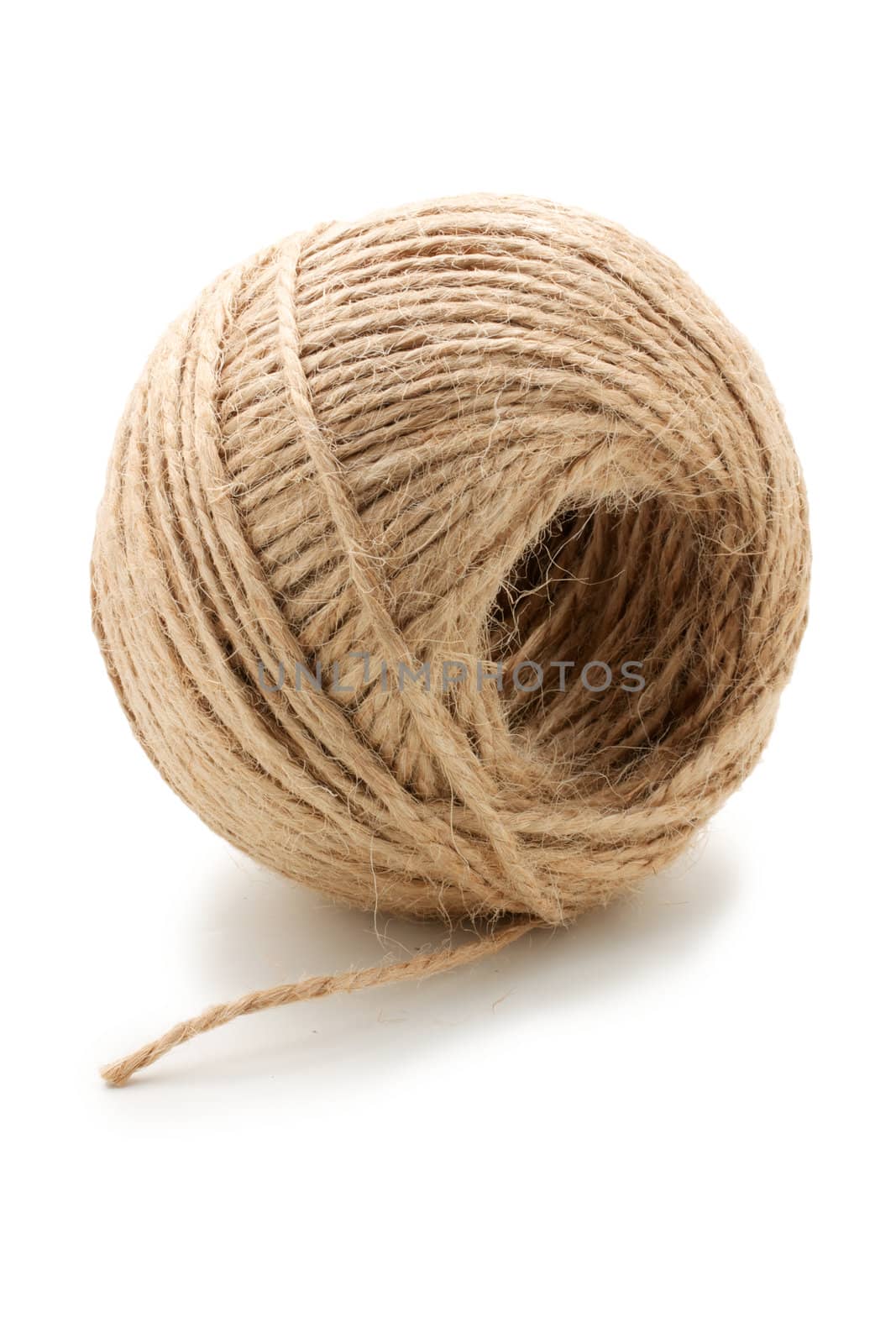 Hank natural twine. Hank is on the side and end of string is separately. On a white background.