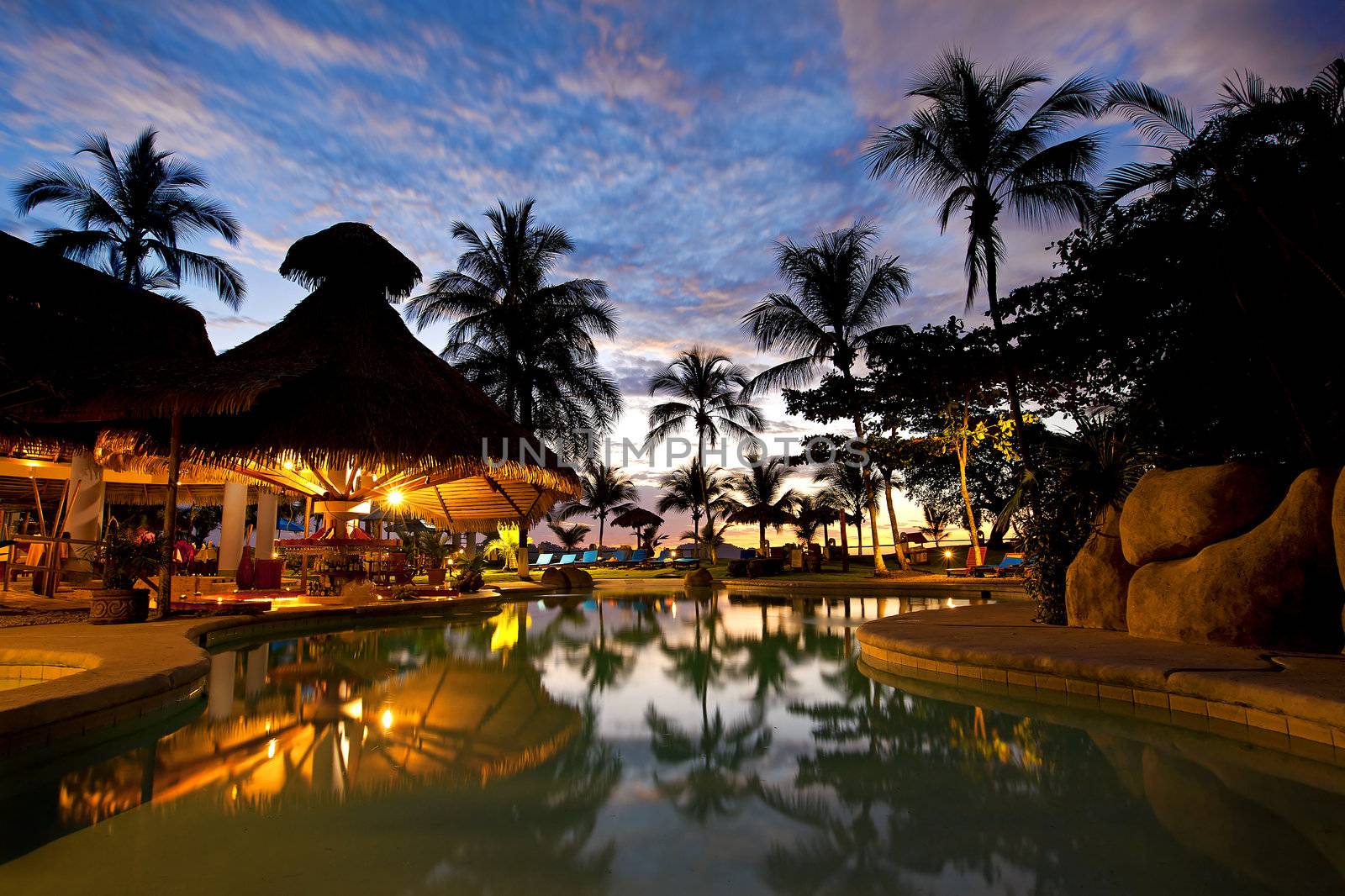 Evening picture of the swimming pool area on a resort