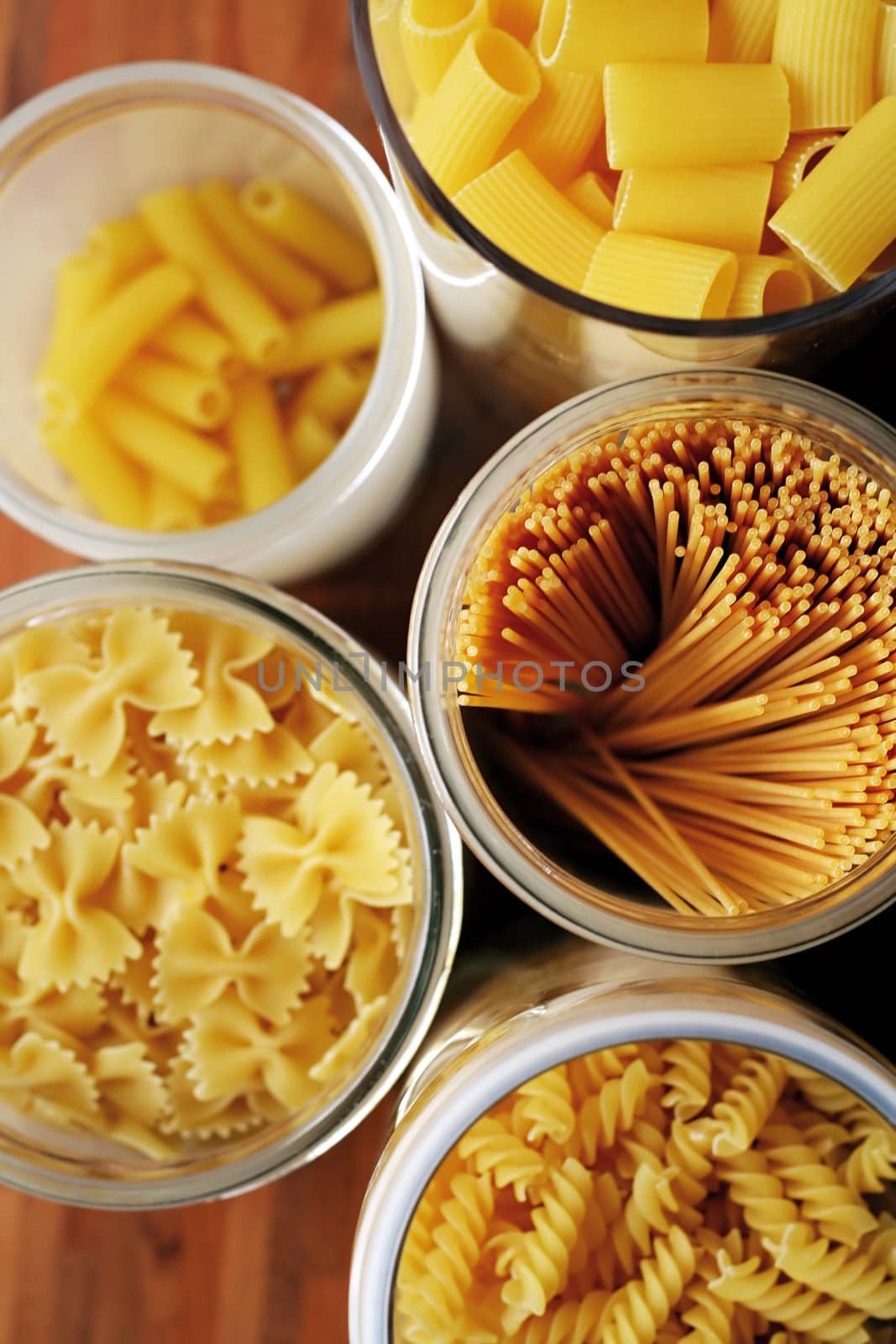 five glasses with noodles in the kitchen