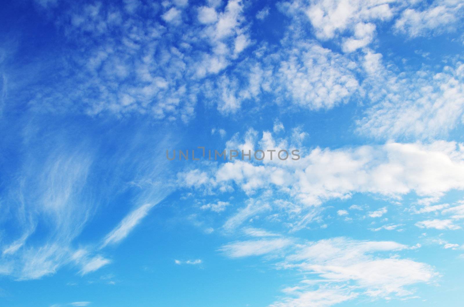 blue sky background with tiny clouds