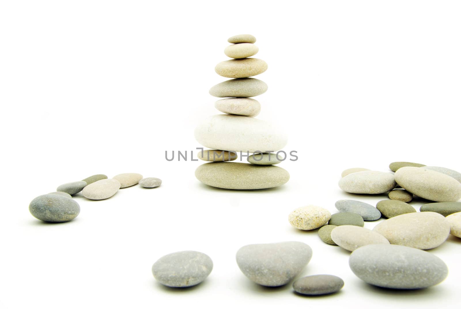 Stack of balanced stones on a white background