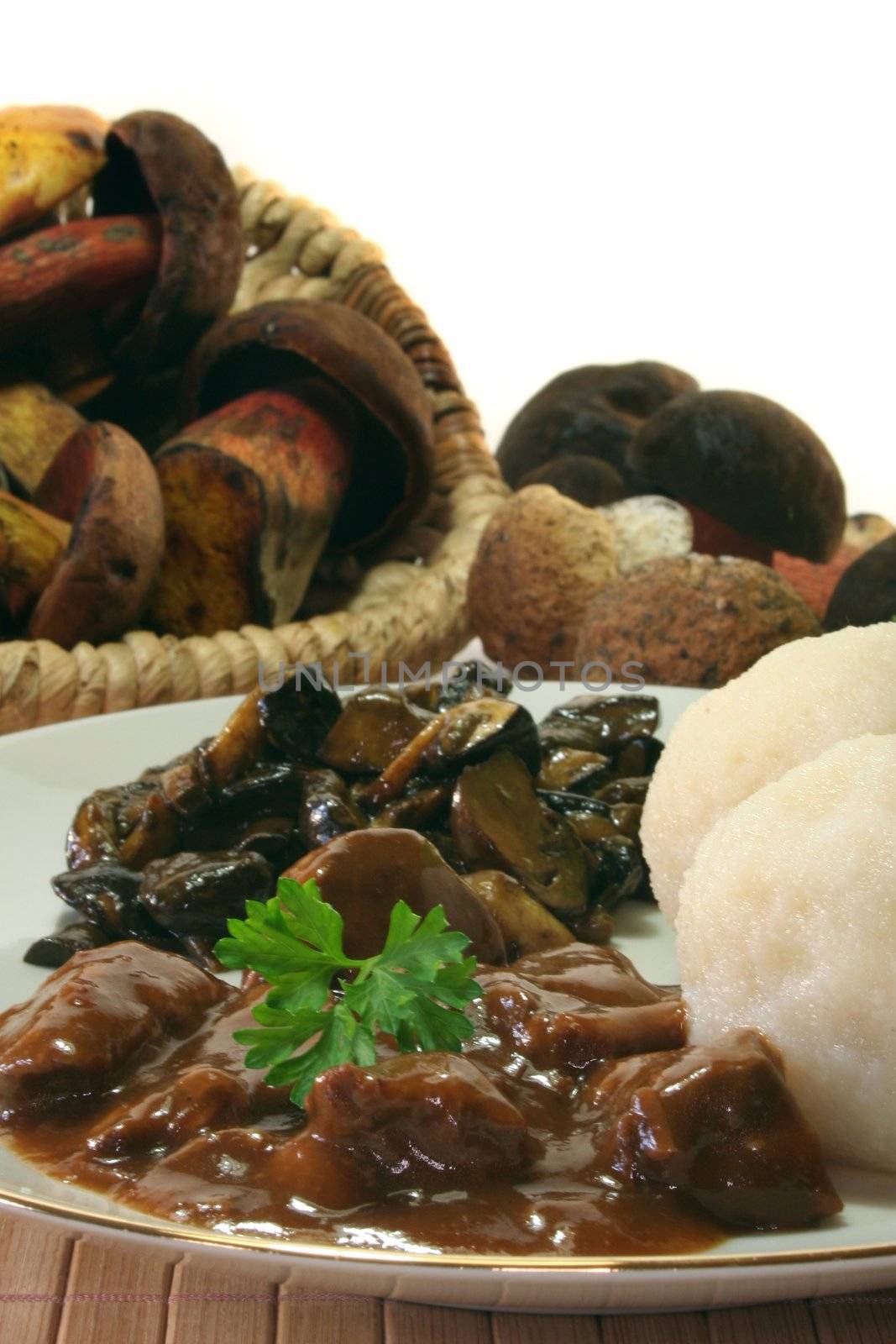 Venison goulash with dumplings and fresh mushrooms