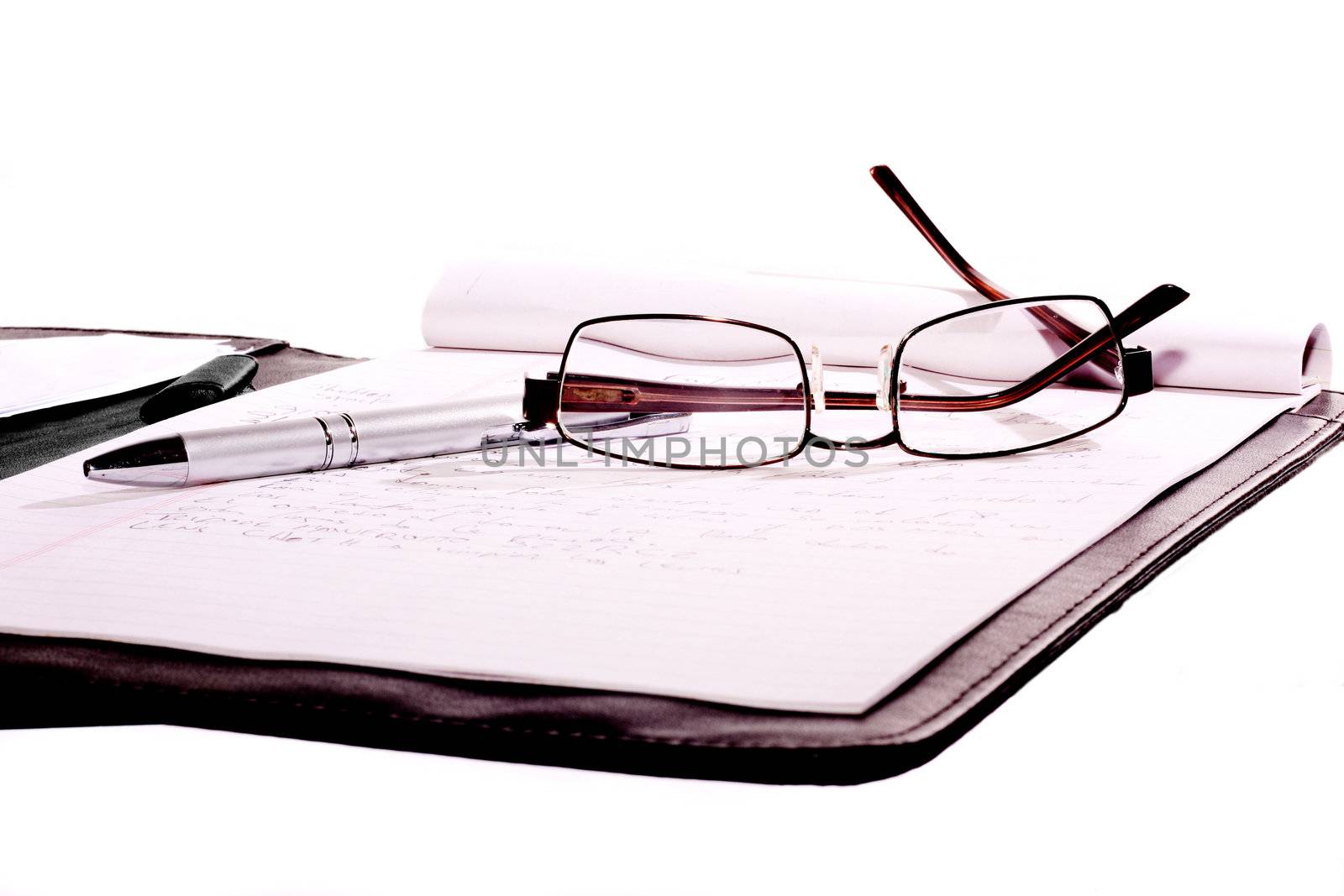 sunglasses and pen place on note book isolate on white background