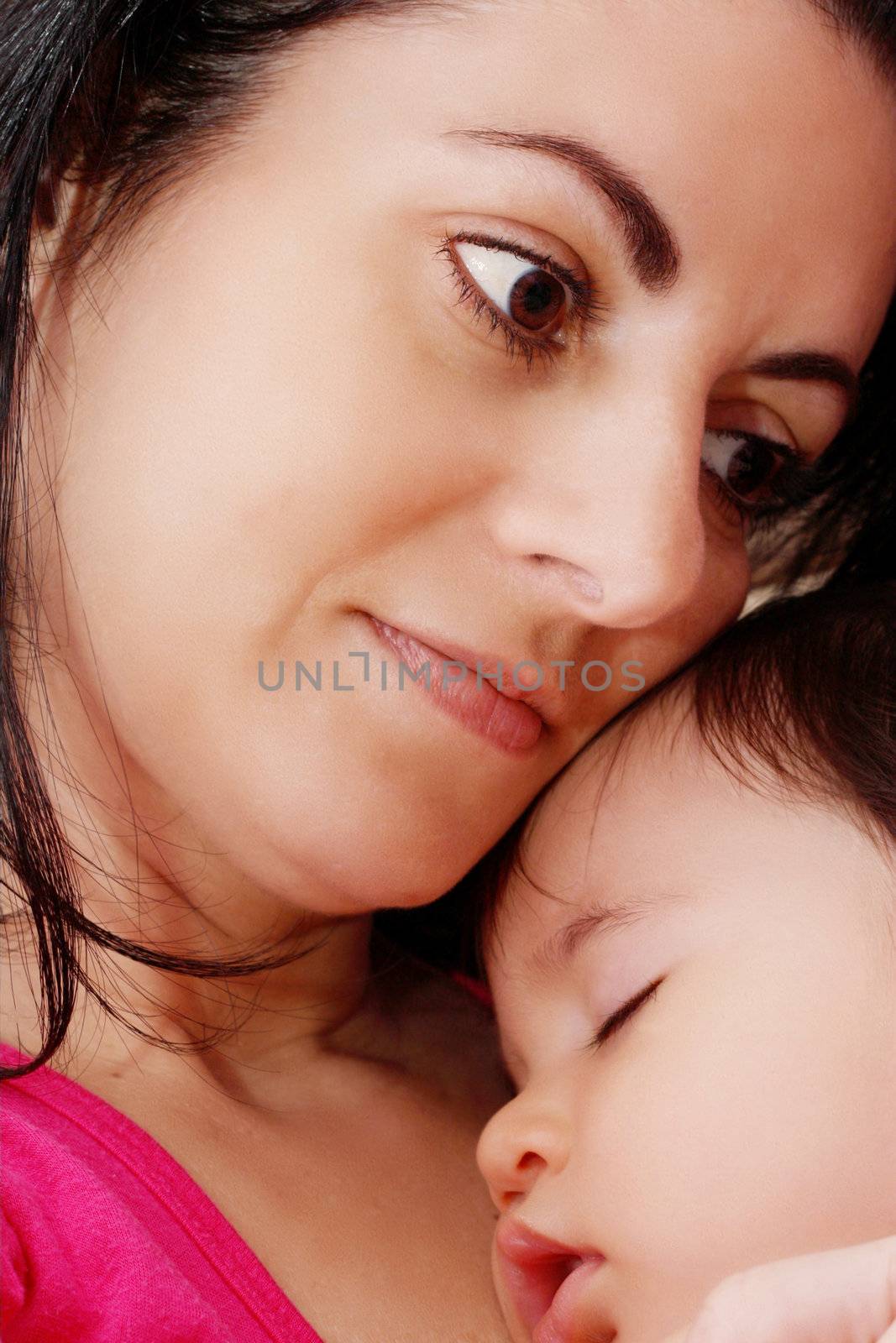 Beautiful baby in his mothers hands.