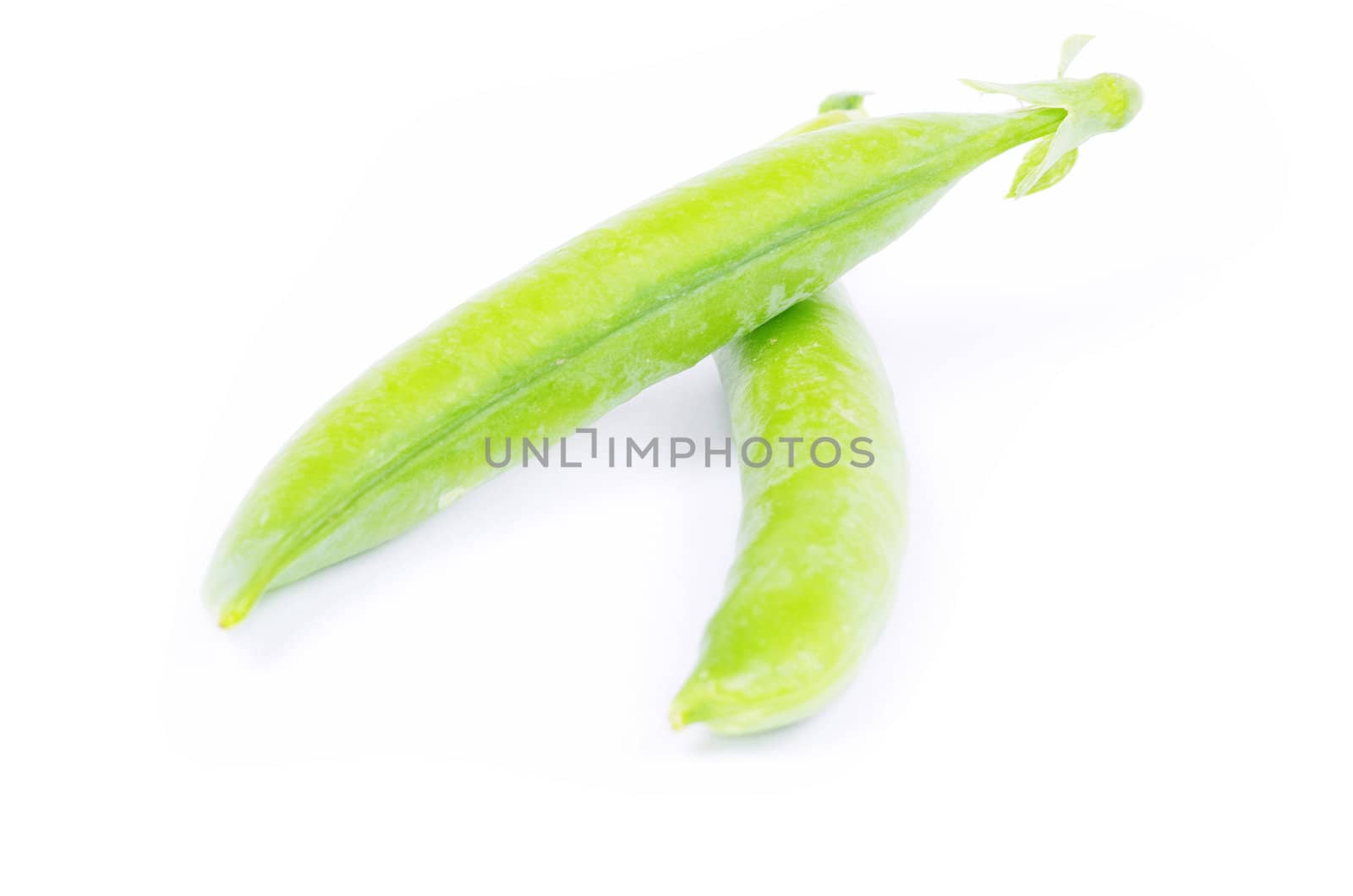 fresh green peas isolated on a white background