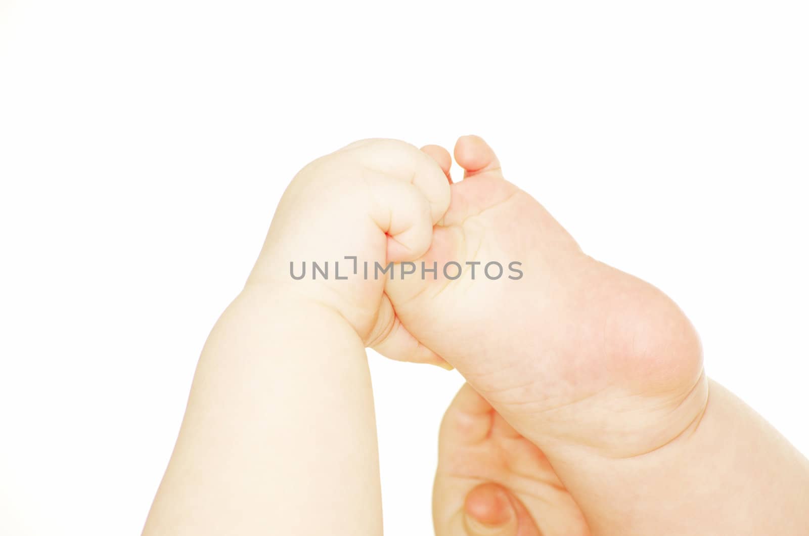 newborn baby feet and hands isolated on white