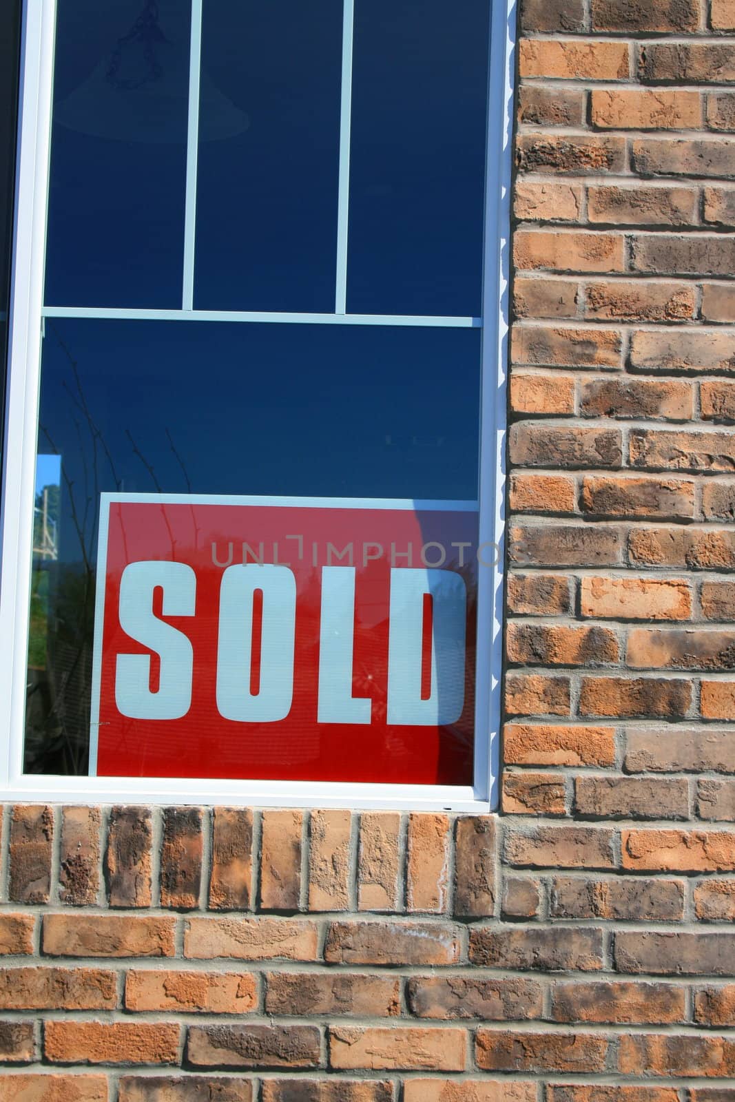 Close up of sold sign in a new sold house.
