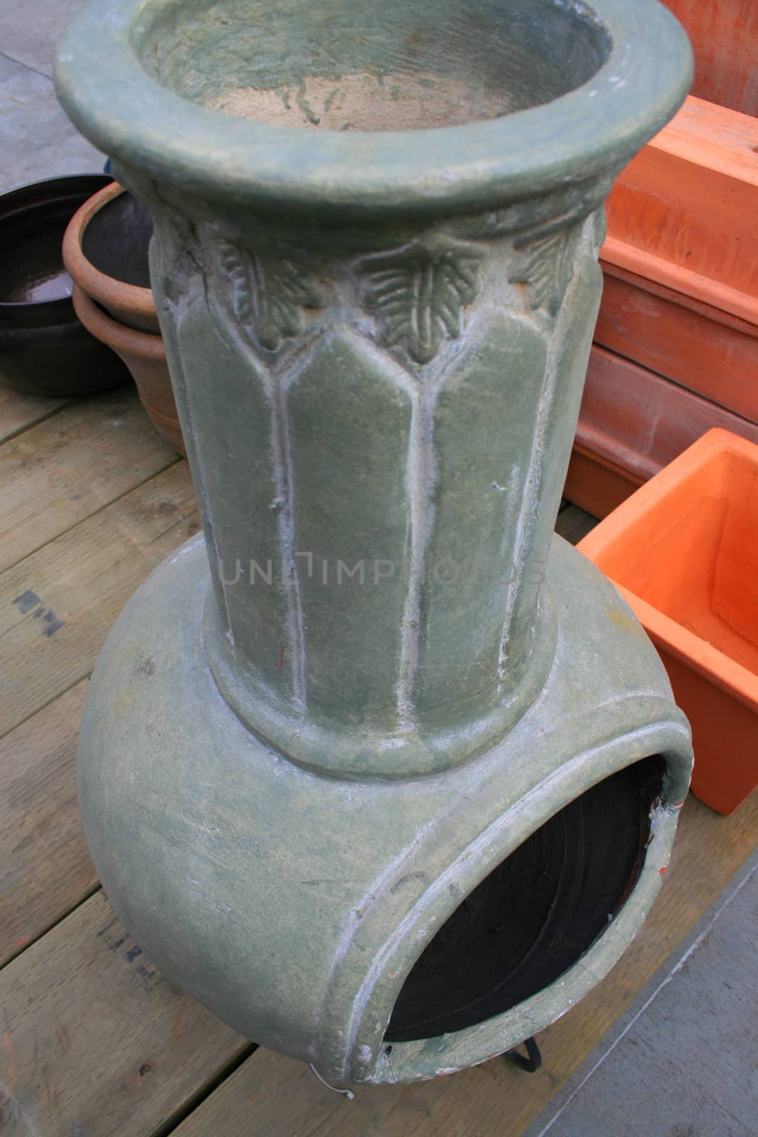 Close up of a gray garden fireplace.
