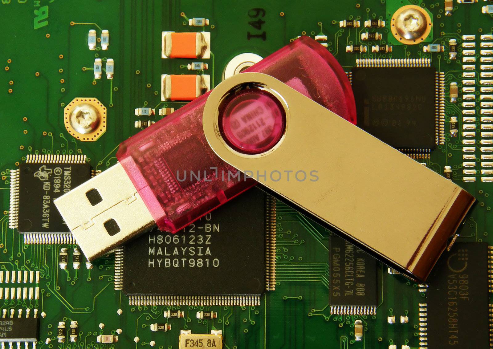 USB flash drive on a hard disk. Objects.