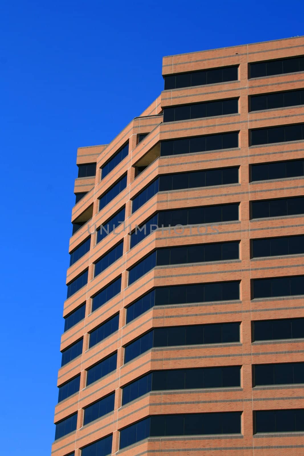 Close up of a modern building over blue sky.
