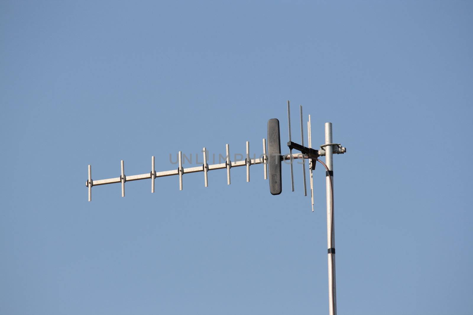 tv aerial against a clear blue sky