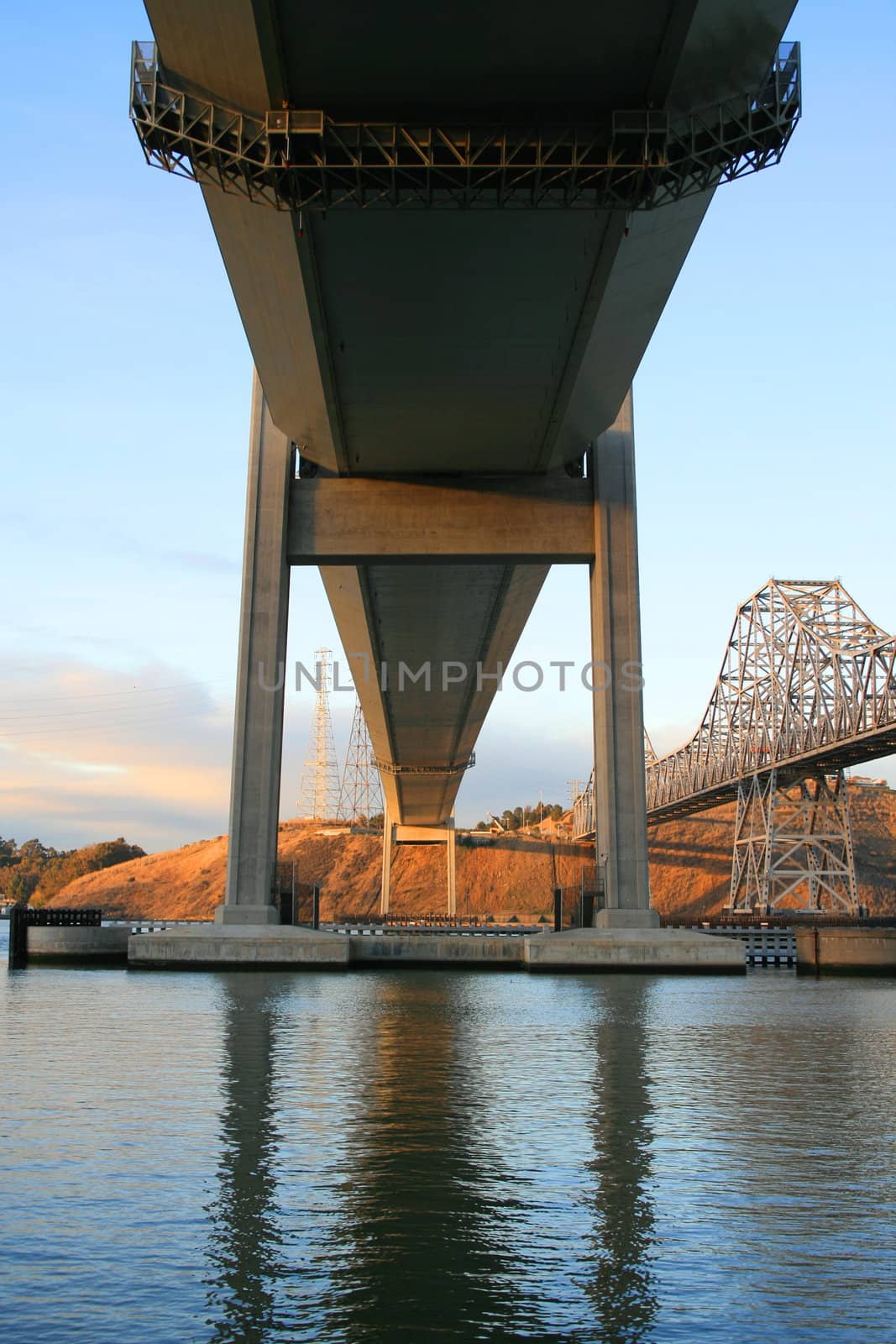 Two tall bridges built over a river.
