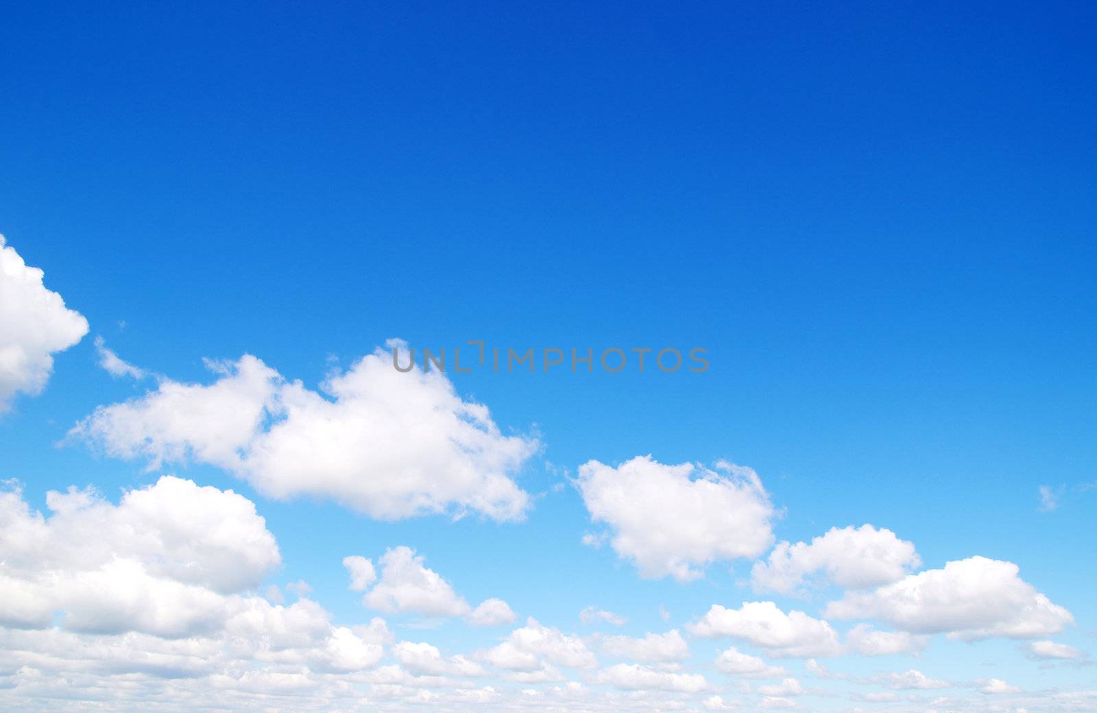 blue sky background with tiny clouds