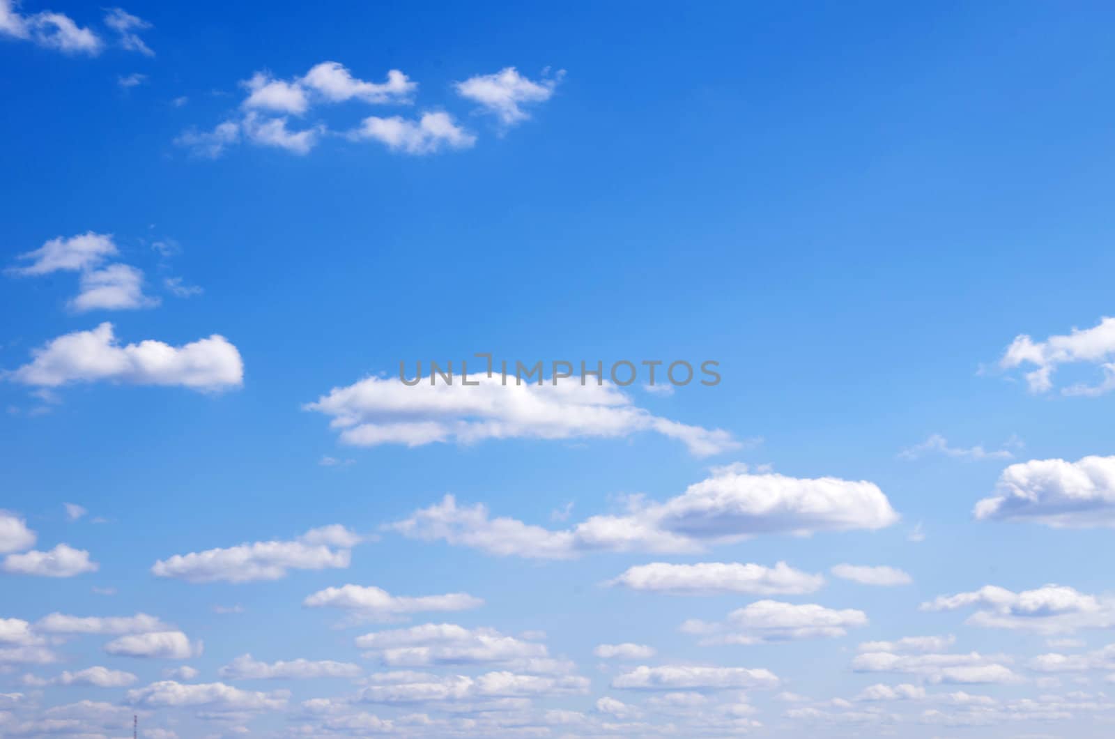 Blue sky background with a tiny clouds       