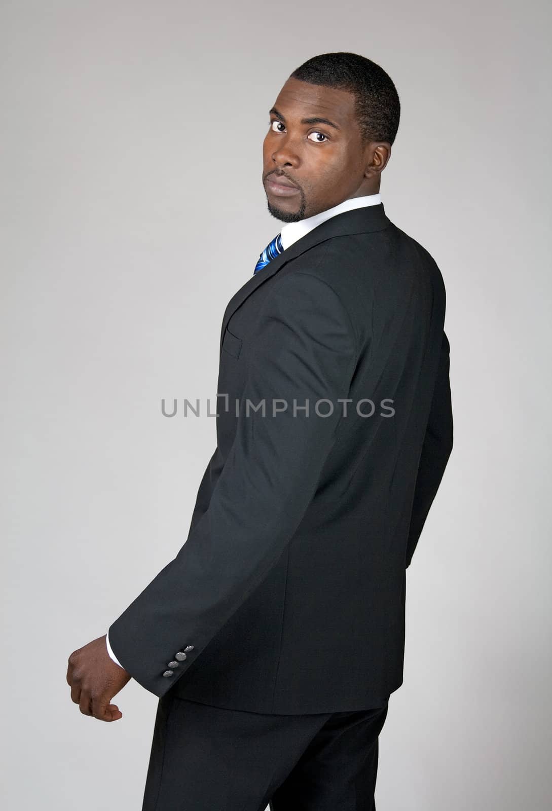 African American businessman looking back by anikasalsera