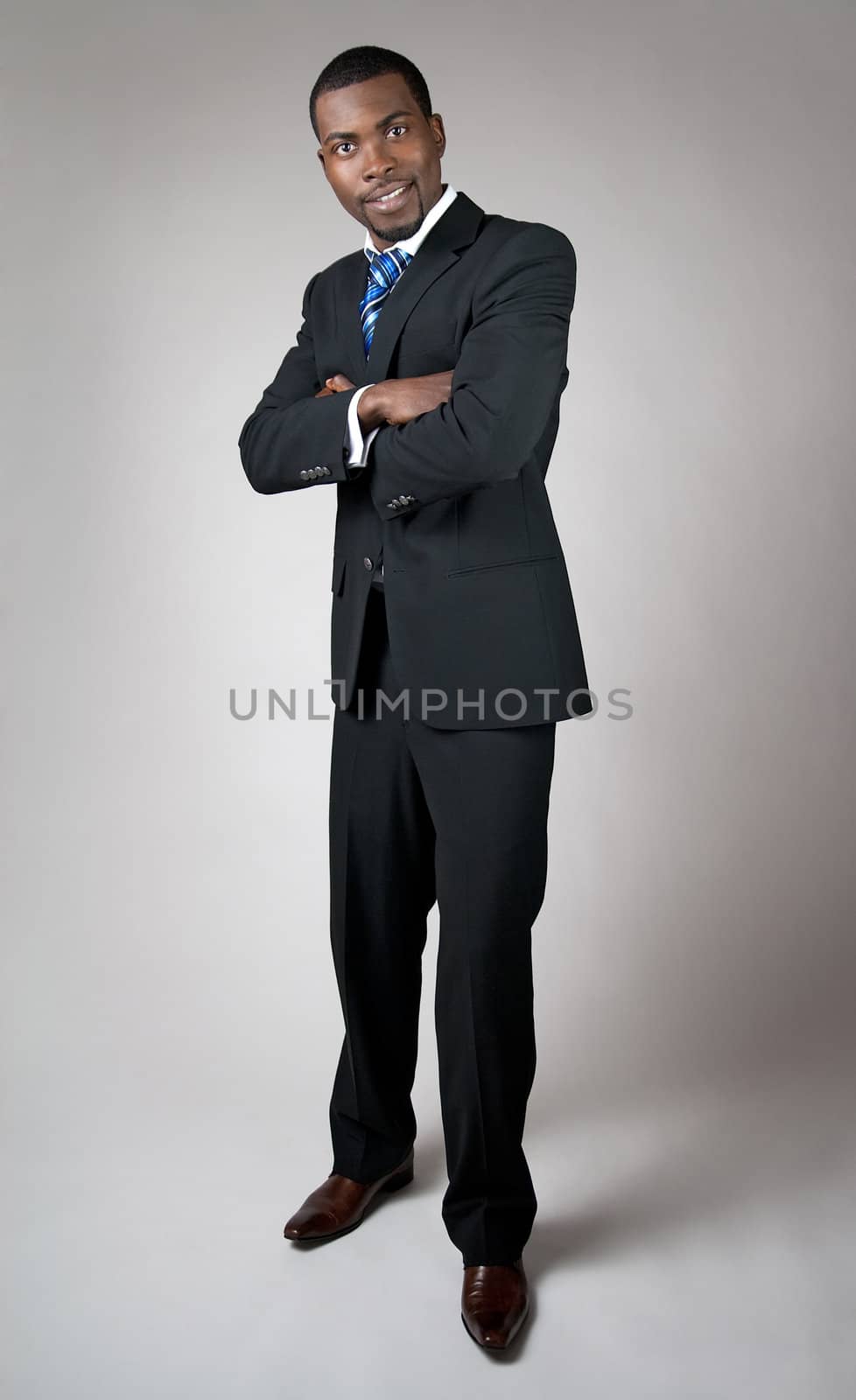 African American businessman with his arms crossed by anikasalsera