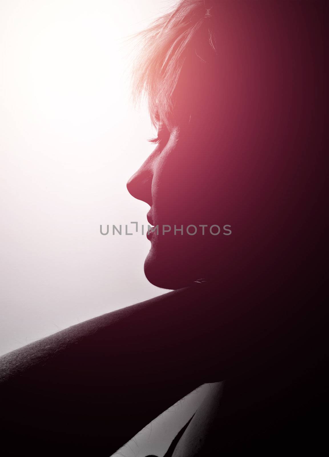 Portrait of a young, blonde girl with short hair and