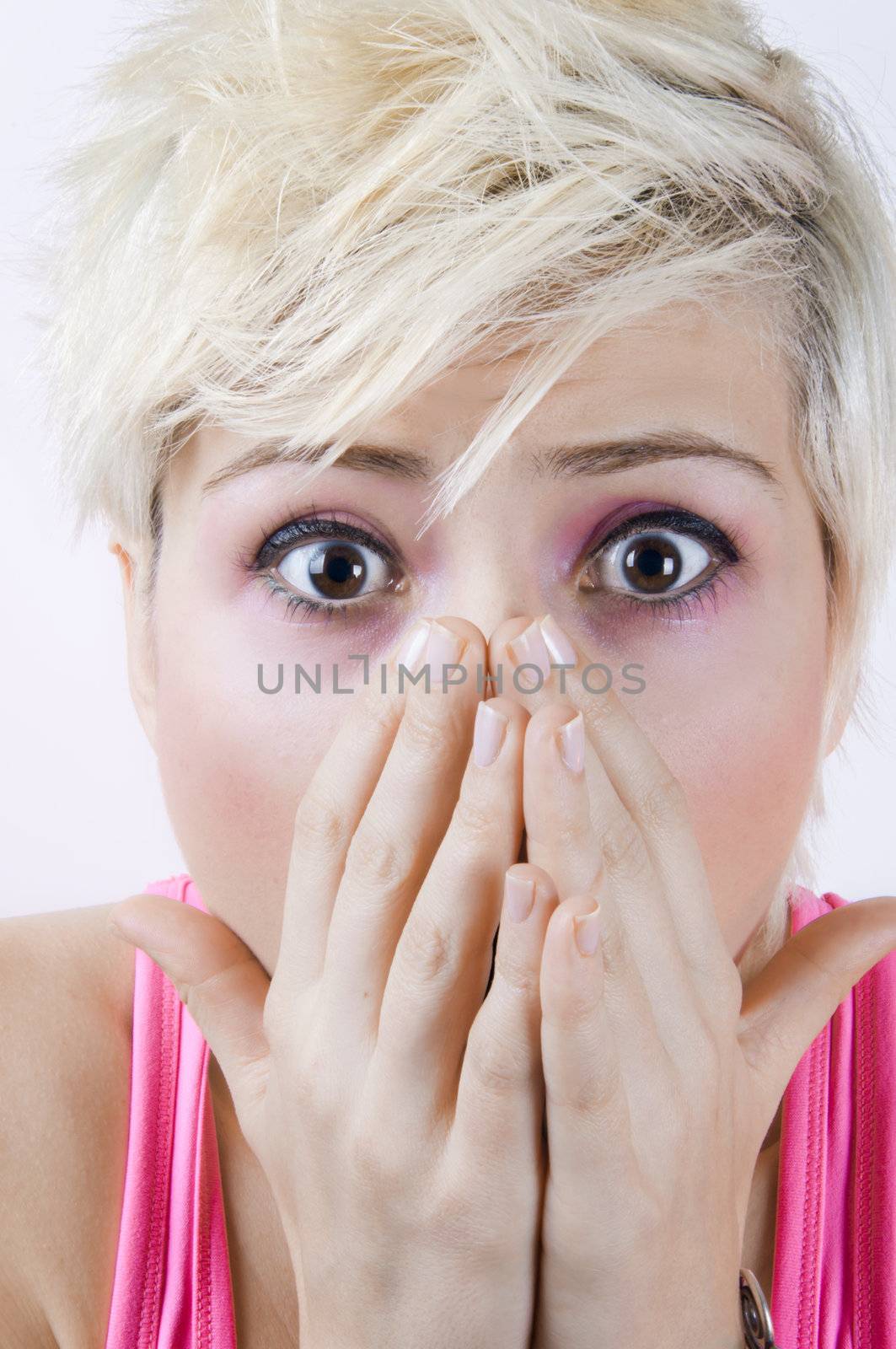 Close up portrait image of a shocked blonde girl