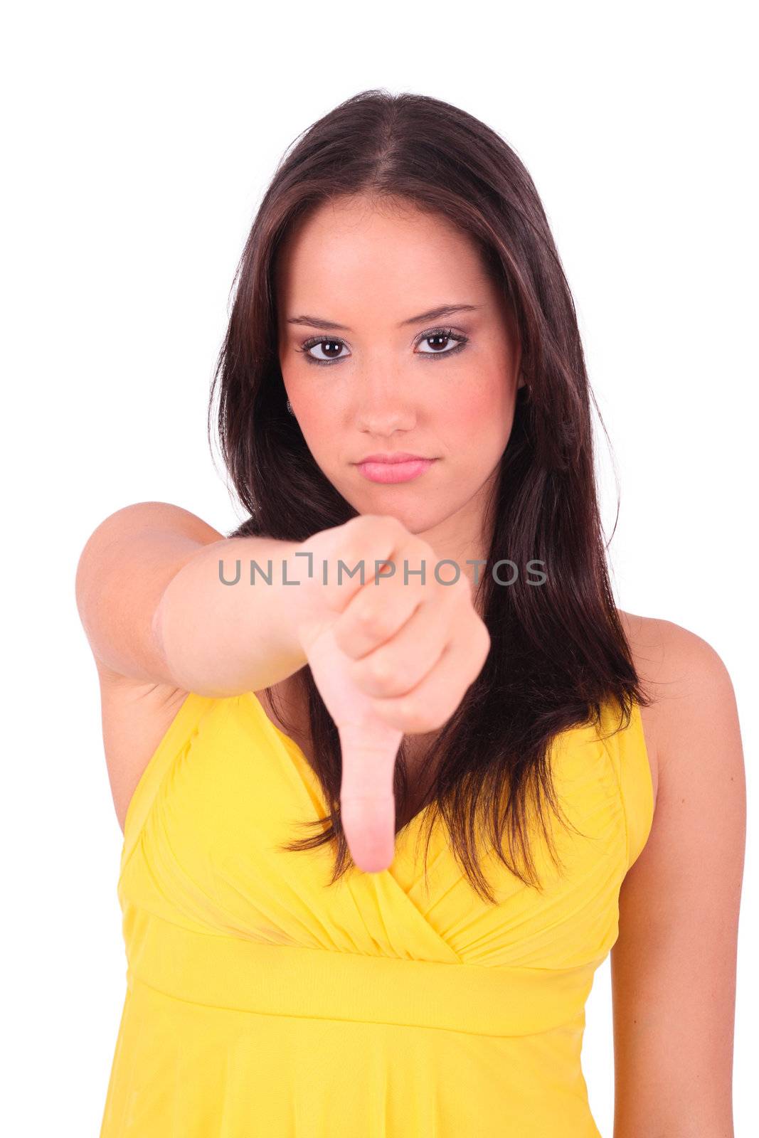 young unhappy and disappointed female shows thumbs down gesture, isolated on white