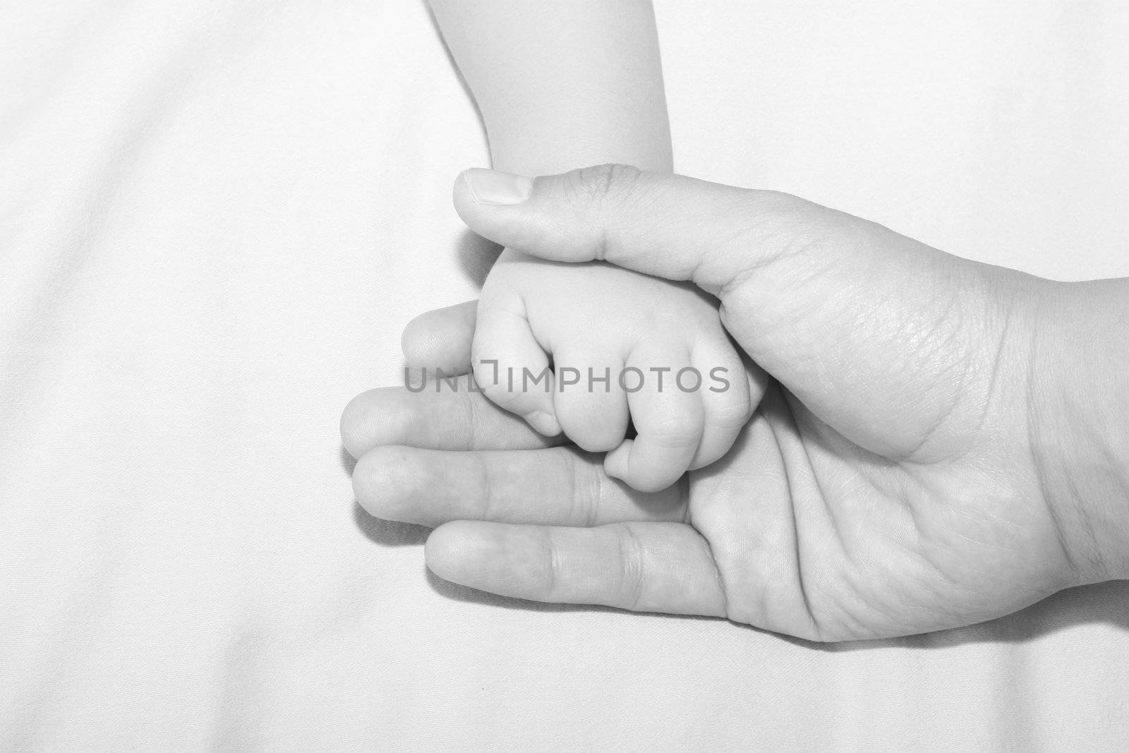 Father holding daughters hand