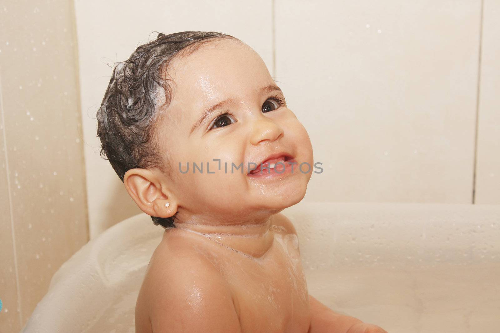 litlle baby bathes in a bathroom by dacasdo