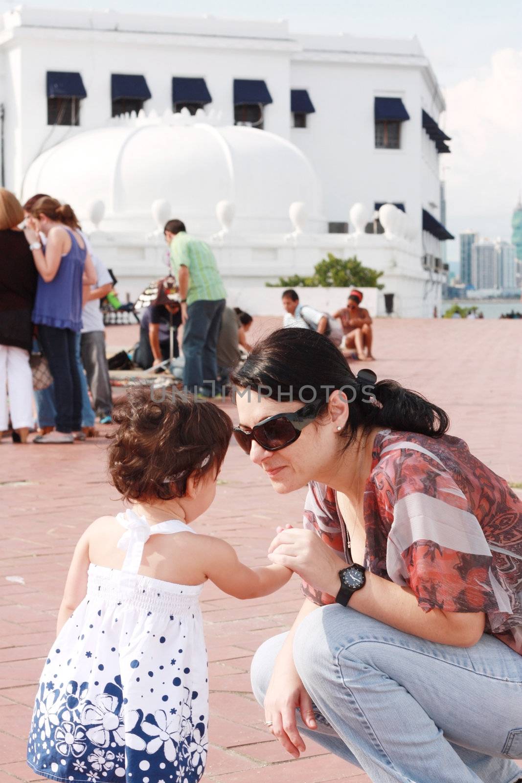 Mother speaking to her baby in the park