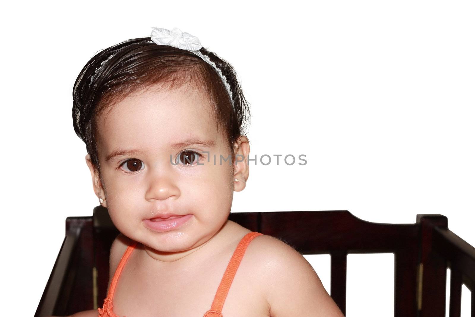 Infant baby playing in her little baby bed at nursery. by dacasdo