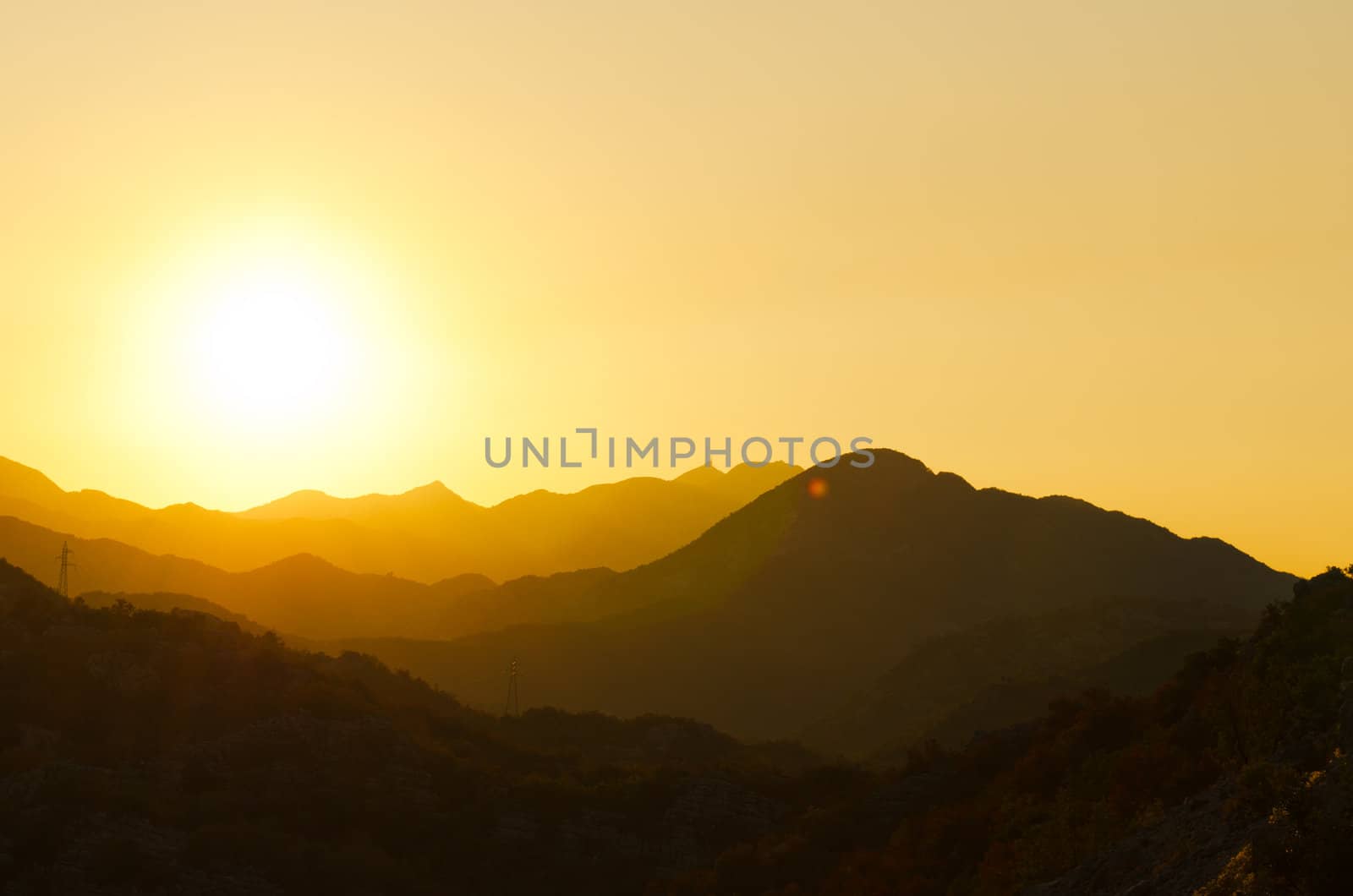 Sunset over mountains in Montenegro on a warm sunny day