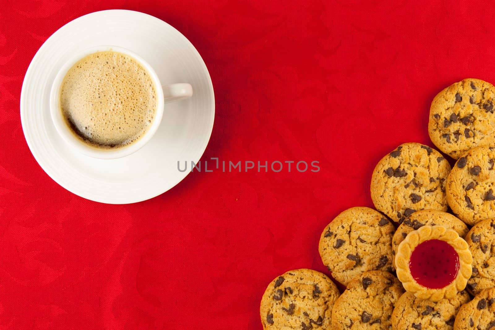 Coffee and cookies on a red background