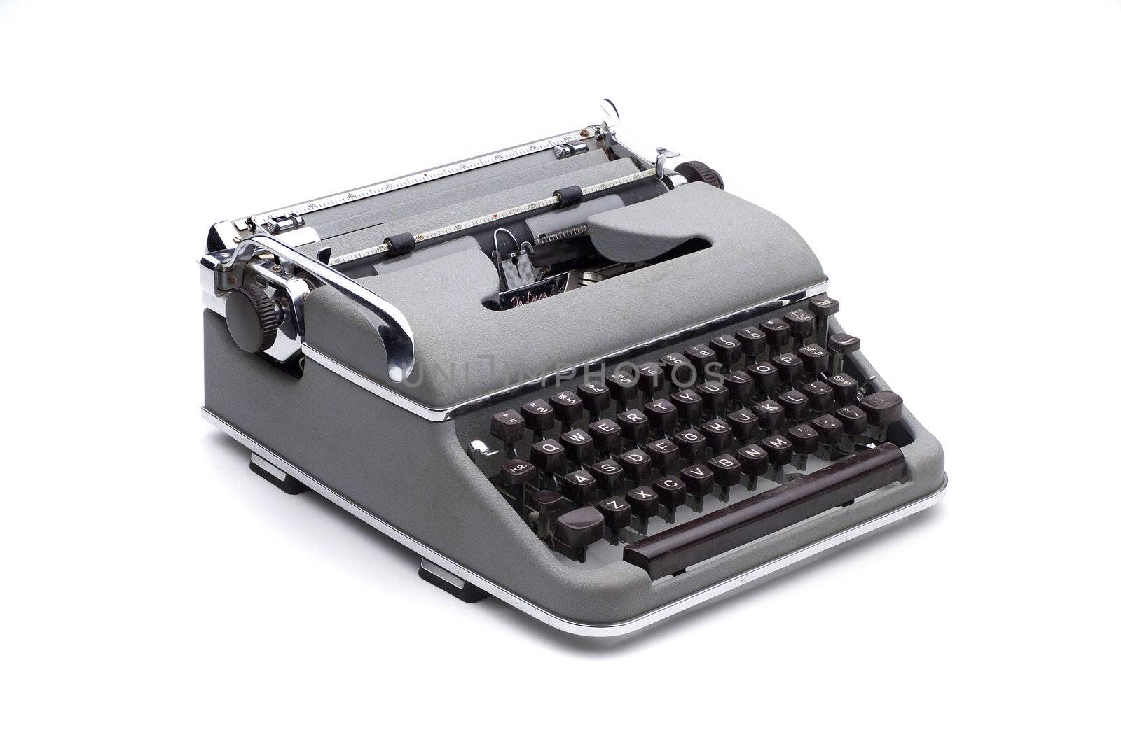 Gray vintage portable typewriter on white, isolated with clipping path