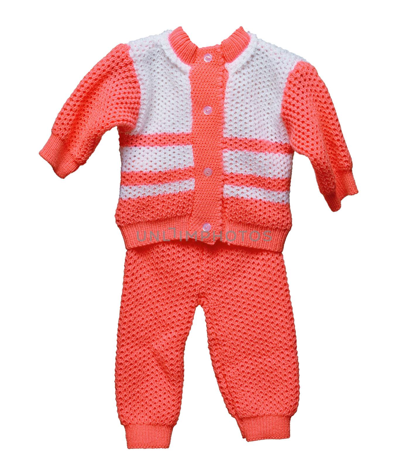 Knitted wool overalls for baby on white by pzaxe