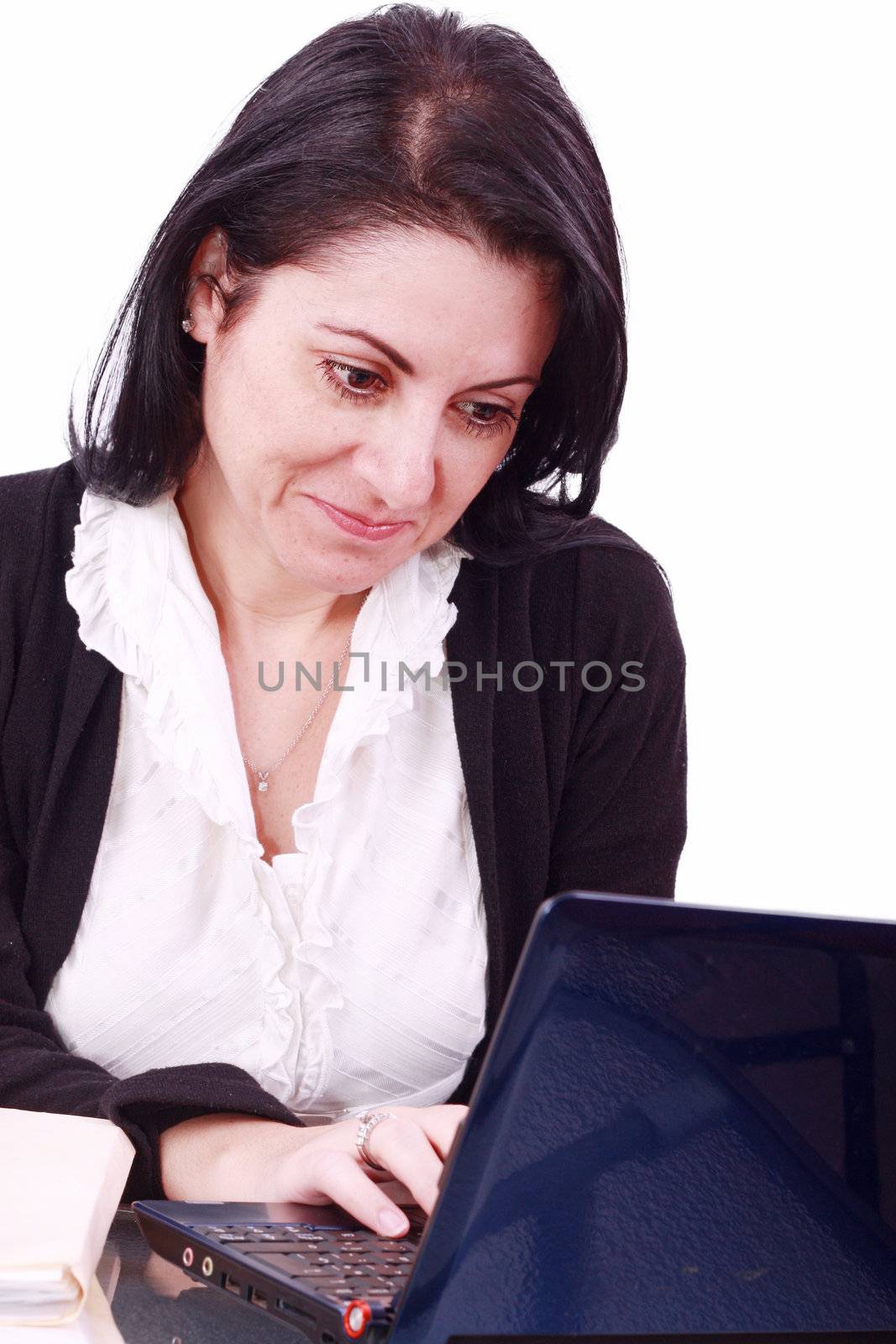 Beautiful businesswoman working on laptop in the office