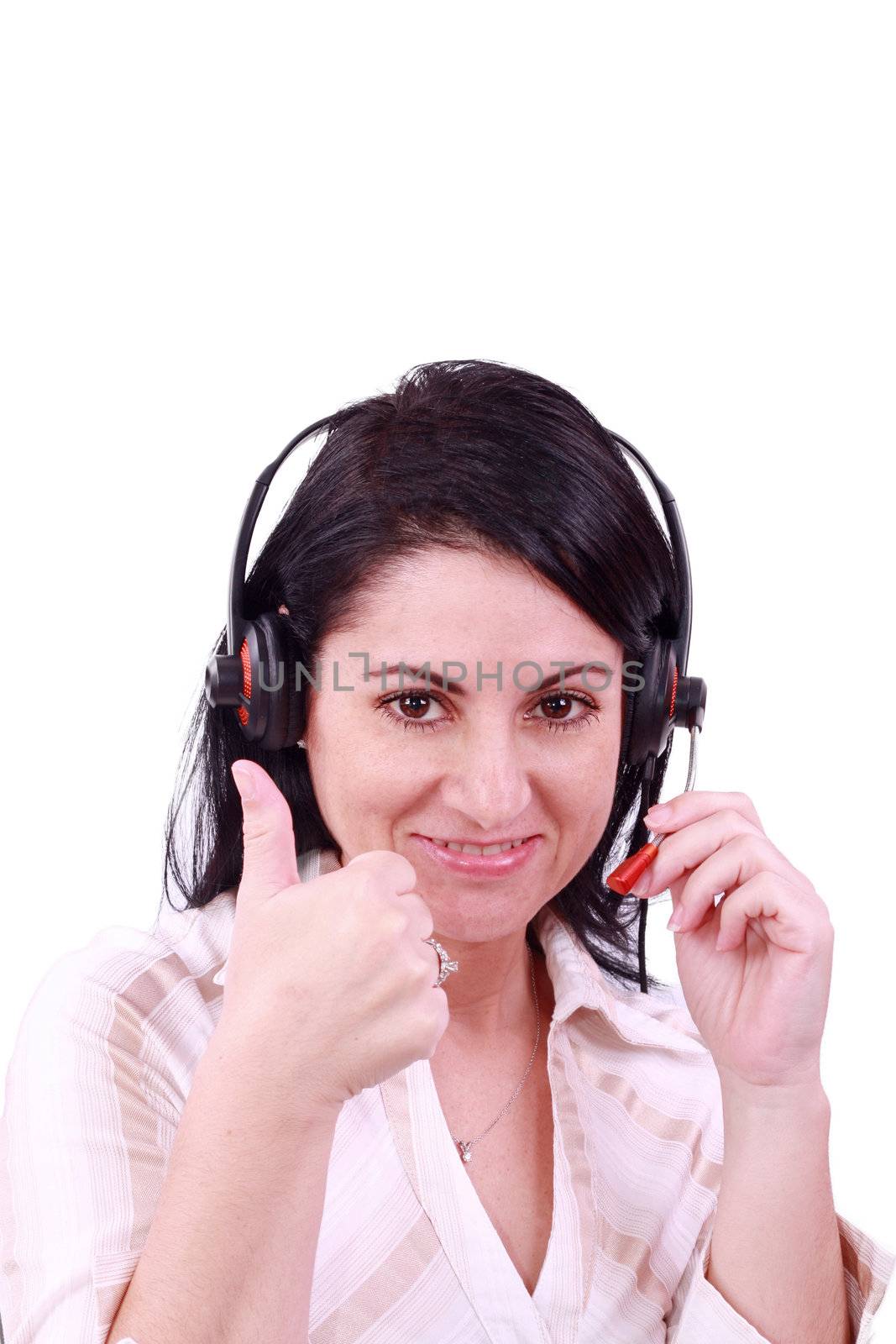 smiling call center young woman with a headset thumb up by dacasdo