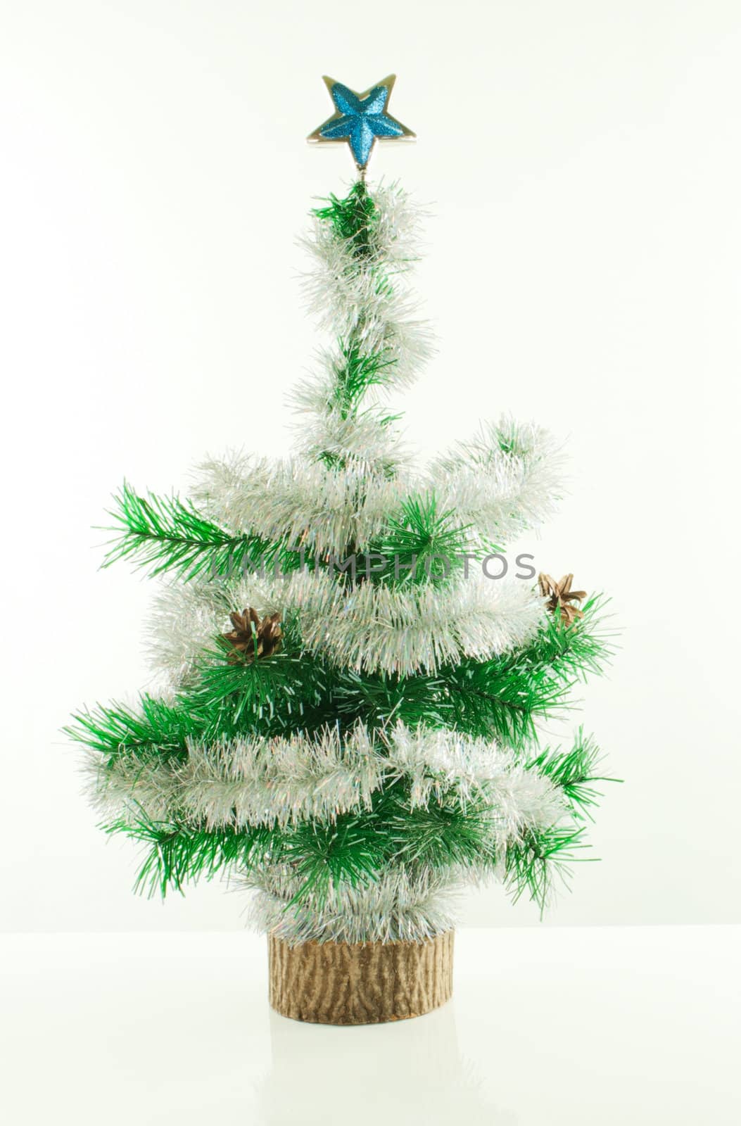 Decorated Christmas tree over white background