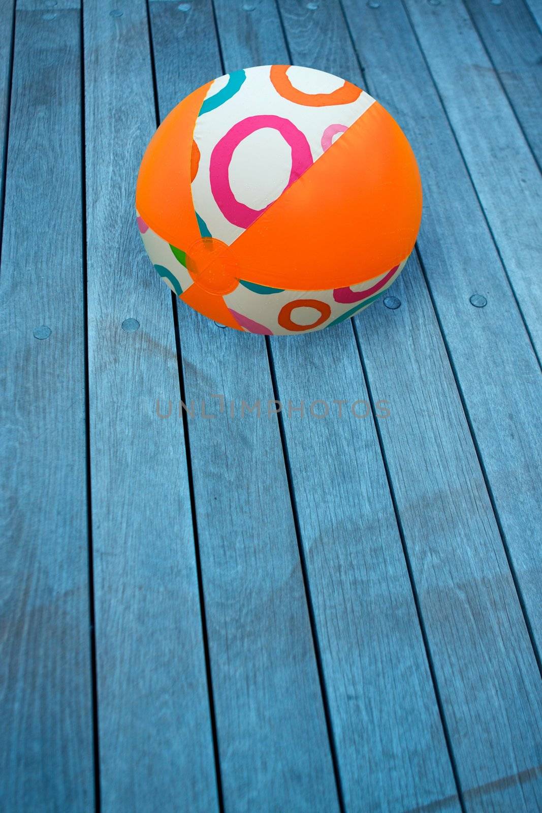 Wooden decking with a beach ball