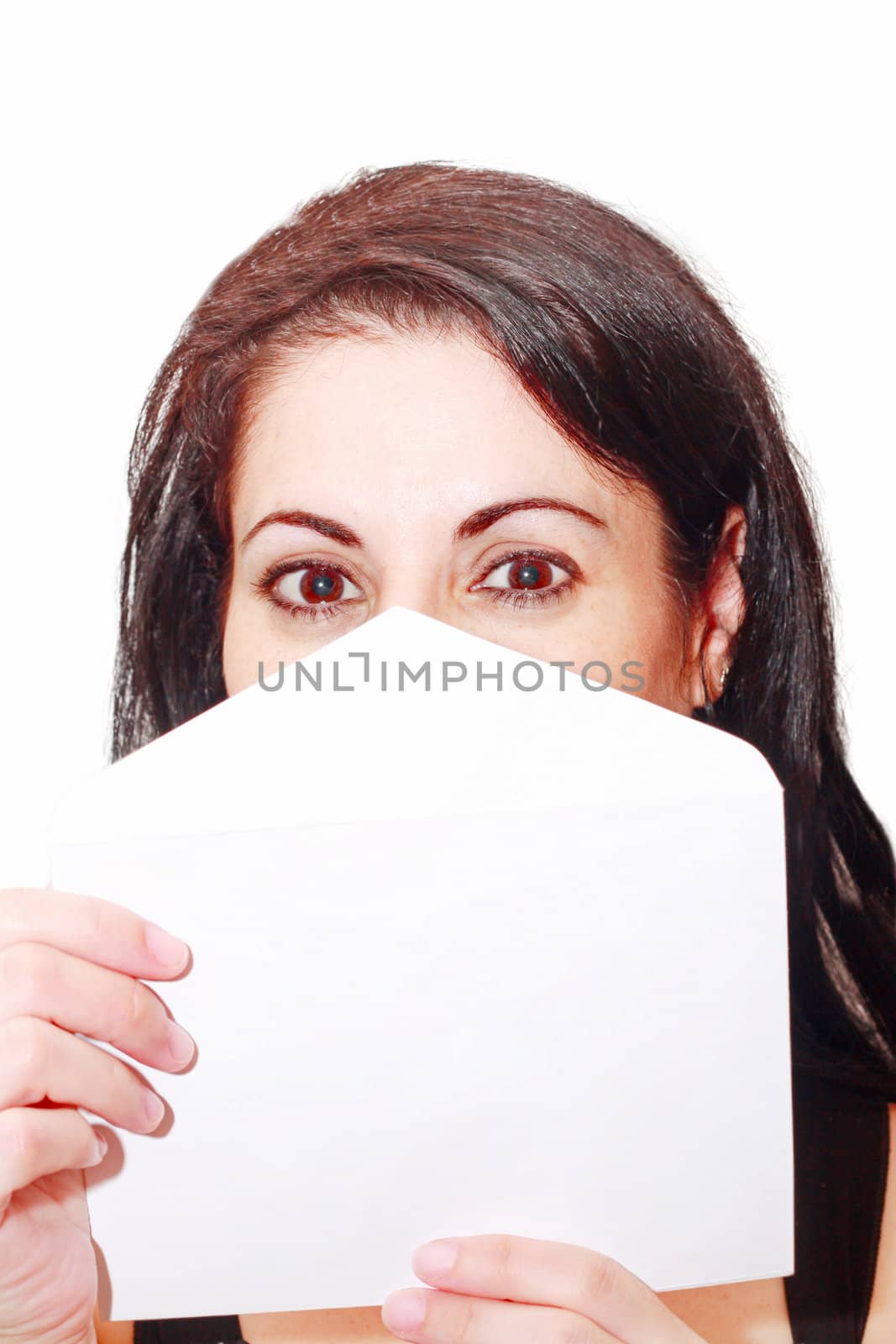 Beautiful woman covering her face with a letter isolated by dacasdo